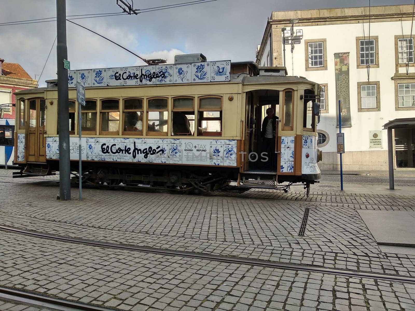 Porto, Europe Portugal -June 7, 2018.yellow tram, residential building with windows . High quality photo