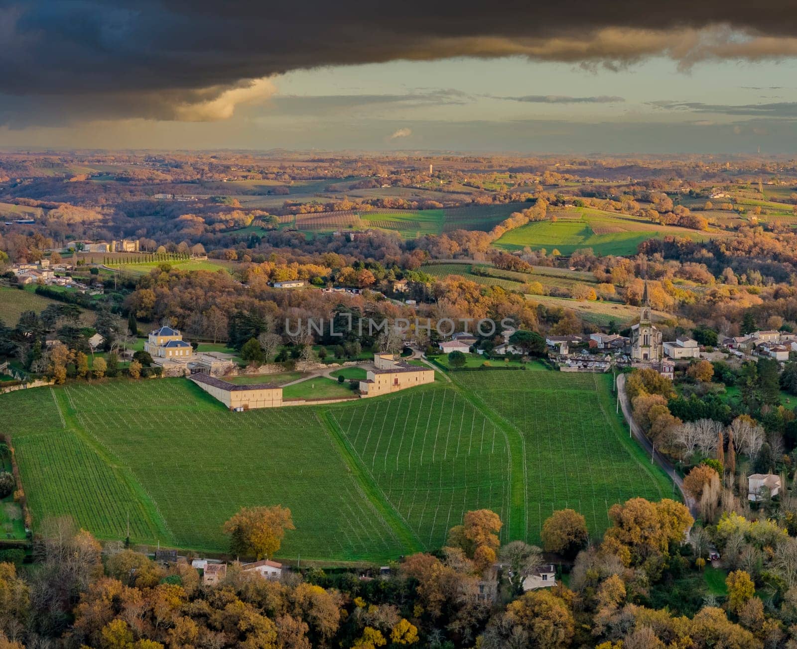 France, Gironde, Tabanac, Aerial view of the vineyard and wooded areas of Chateau le Pic in the Bordeaux vineyards at sunset. High quality photo