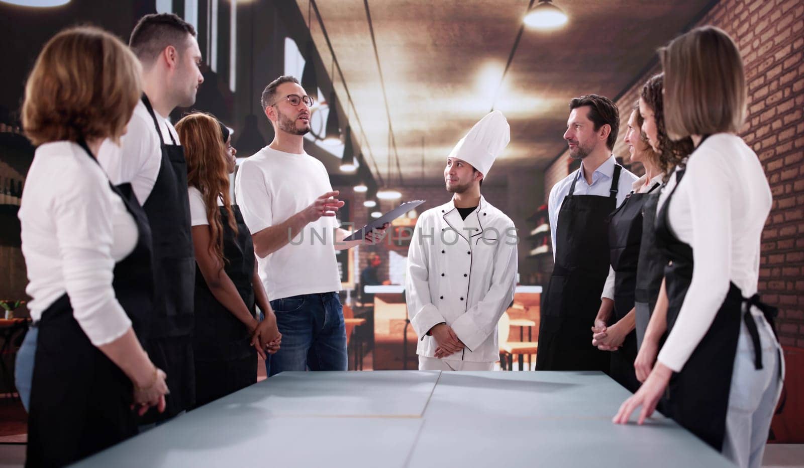 Motivated Restaurant Staff Collaborate with Diverse Team in Meeting