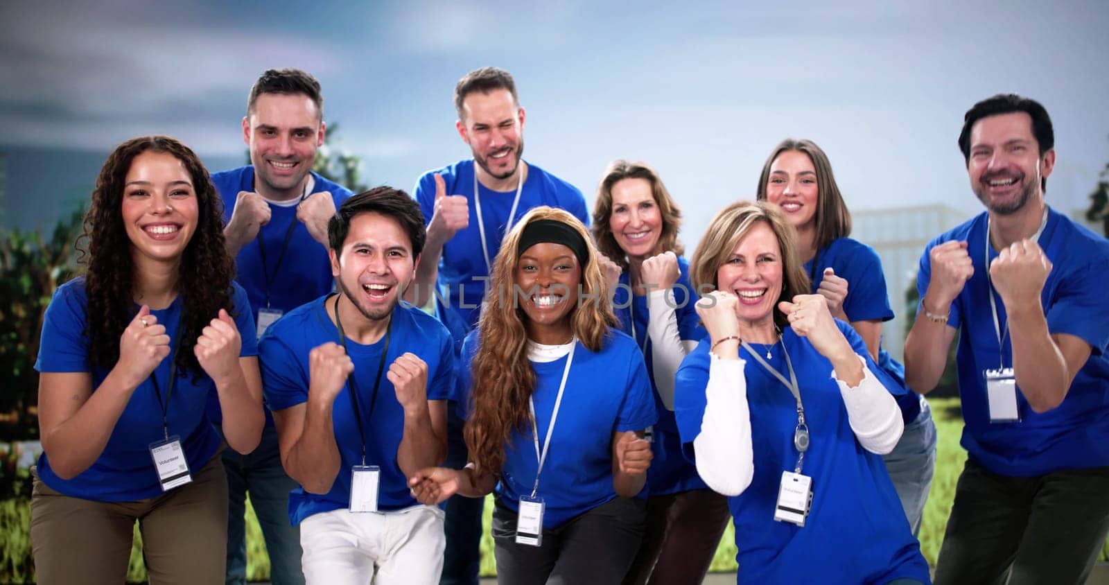 Multiracial Team of Volunteers Celebrate Success in Local Park Event.