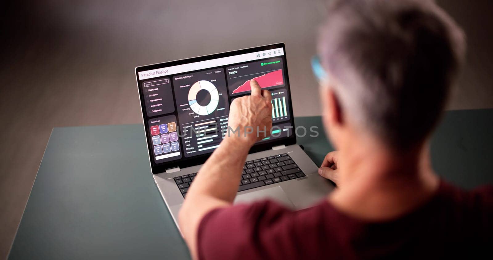Managing Finances With Budget Tracker App On Laptop. Man Tracking Expenses For Online Banking Service. Busy Office Organizer.