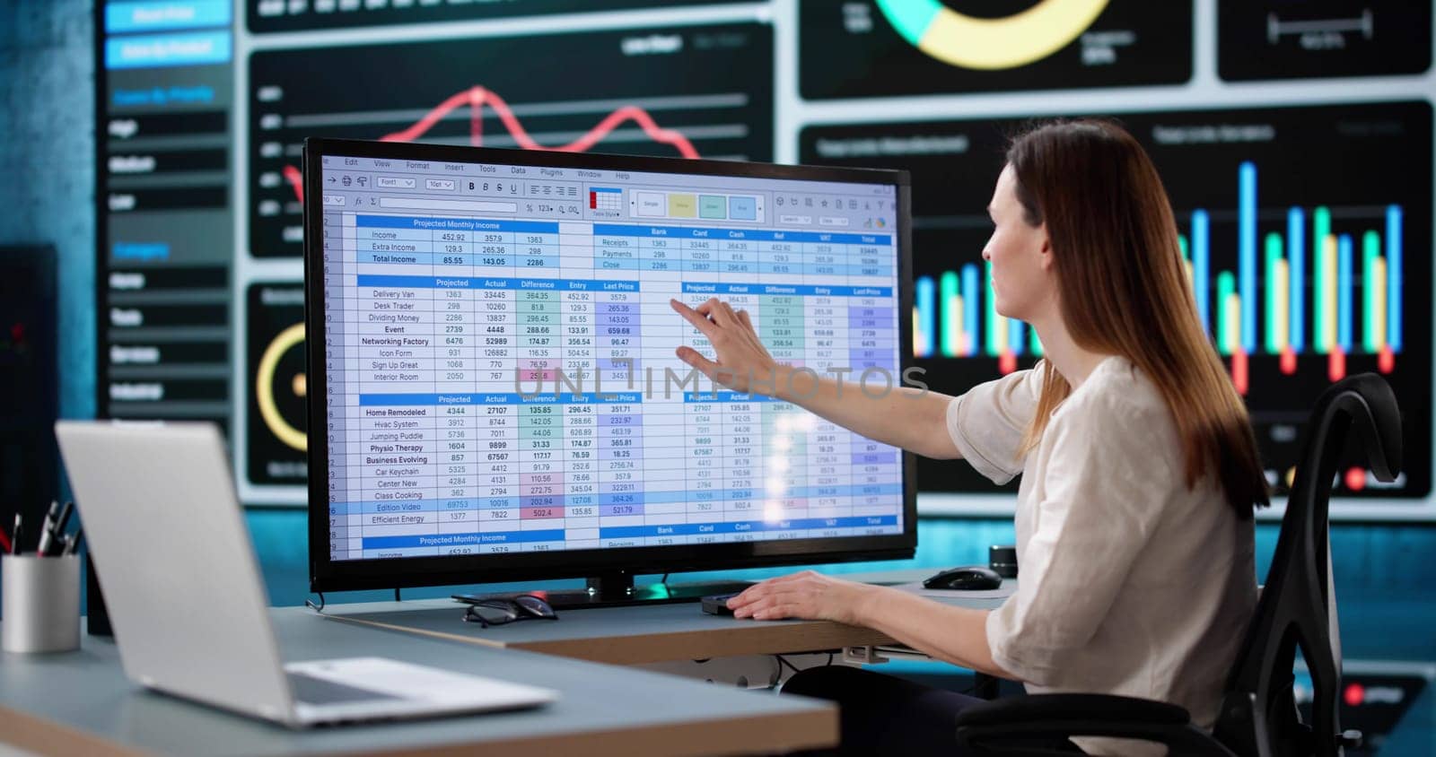 Woman Analyzing Medical Billing Data at Business Office Using Computer.