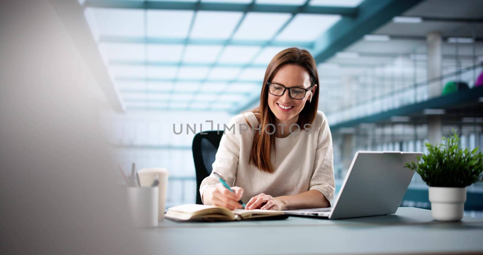 Digital Marketing Specialist Attending Virtual Webinar On Laptop Screen.