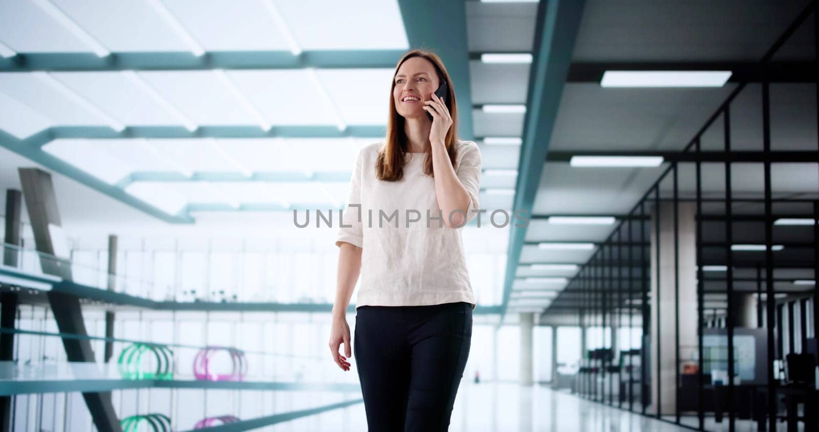 Efficient Businesswoman Utilizing Smartphone for Office Communication While Walking
