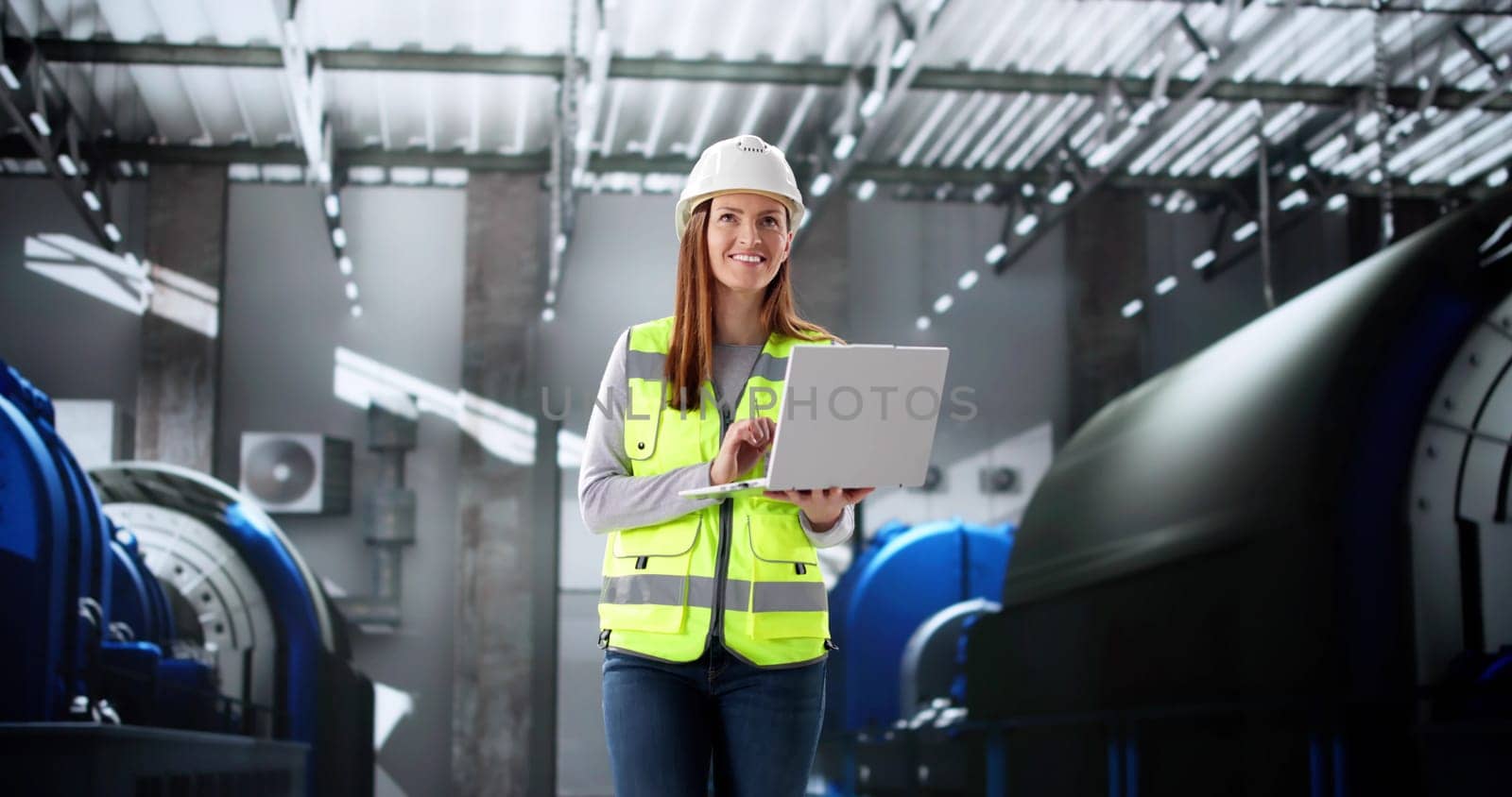 Quality Control Engineer Monitoring Power Plant Inspection with Laptop Software.