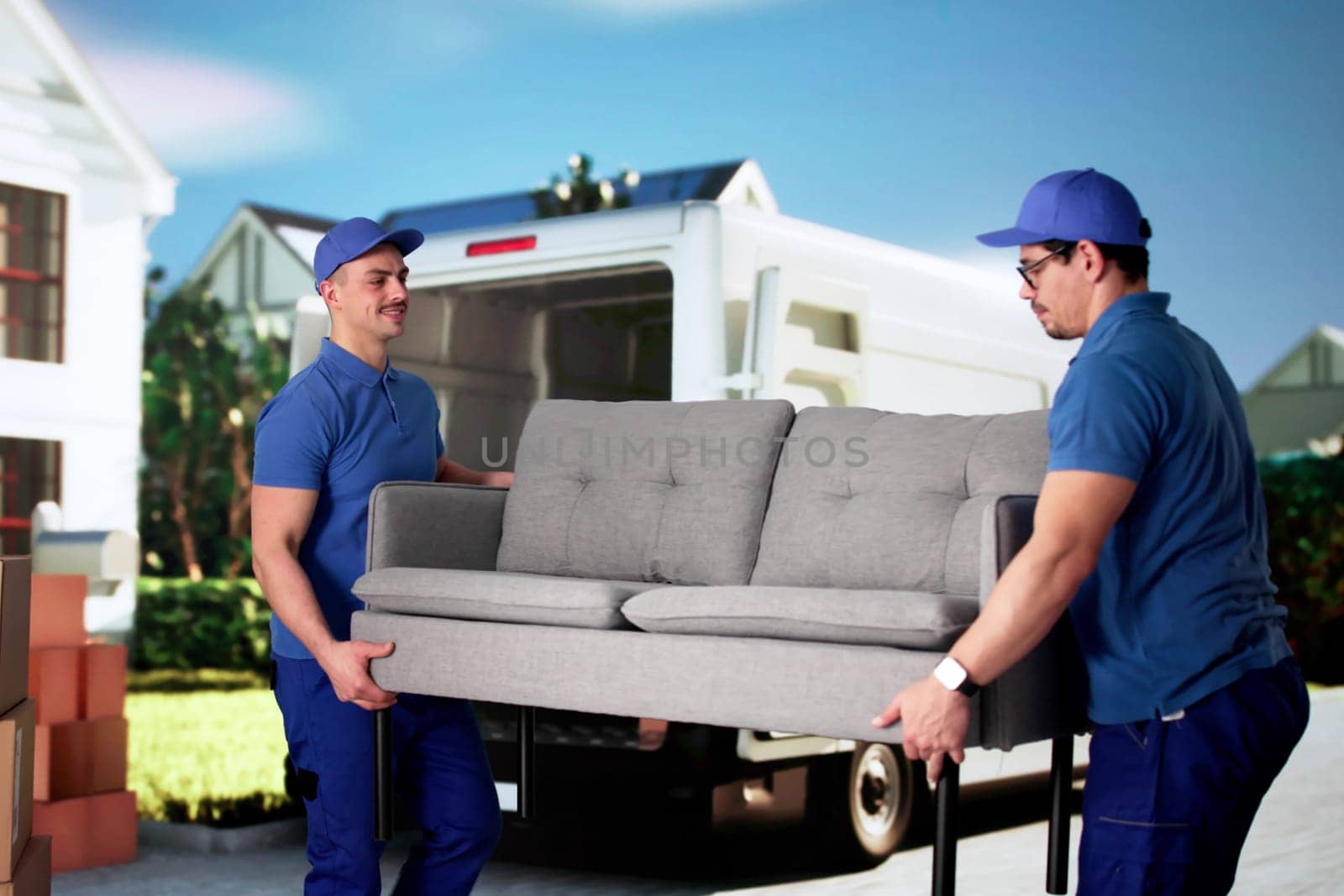 Multiracial Movers Loading Furniture Into Truck For Removal Service