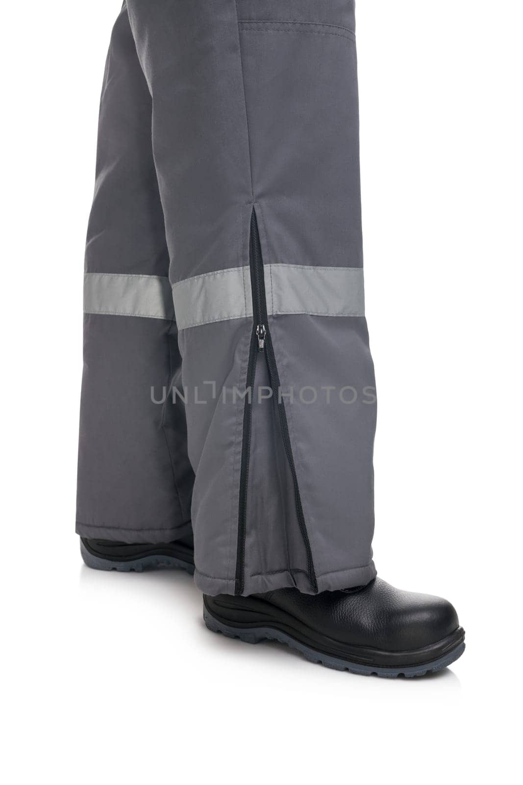 Male in winter work trousers and boots isolated cropped view