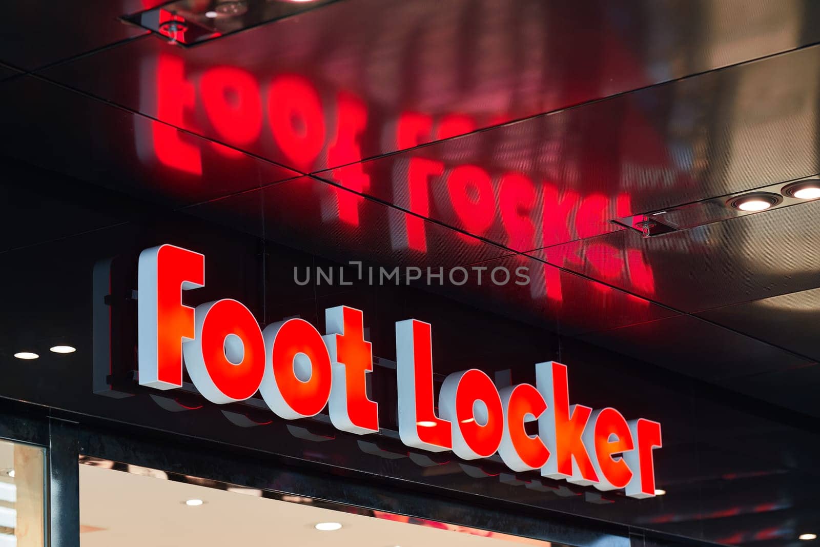 Leipzig, Germany – July 15, 2024: Illuminated sign of the retailer for shoes, Foot Locker in the city center of Leipzig in Germany