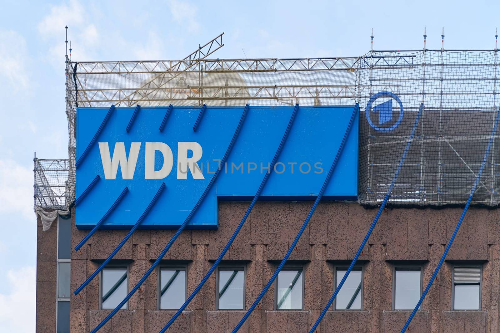 Cologne, Germany – May 23, 2024: Facade with the logo of the German television station WDR, westdeutscher rundfunk in the city center of Cologne