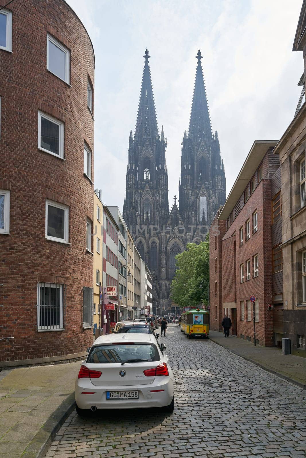 Cologne, Germany – May 19, 2024: Street in Cologne with a view of the landmark, Cologne Cathedral