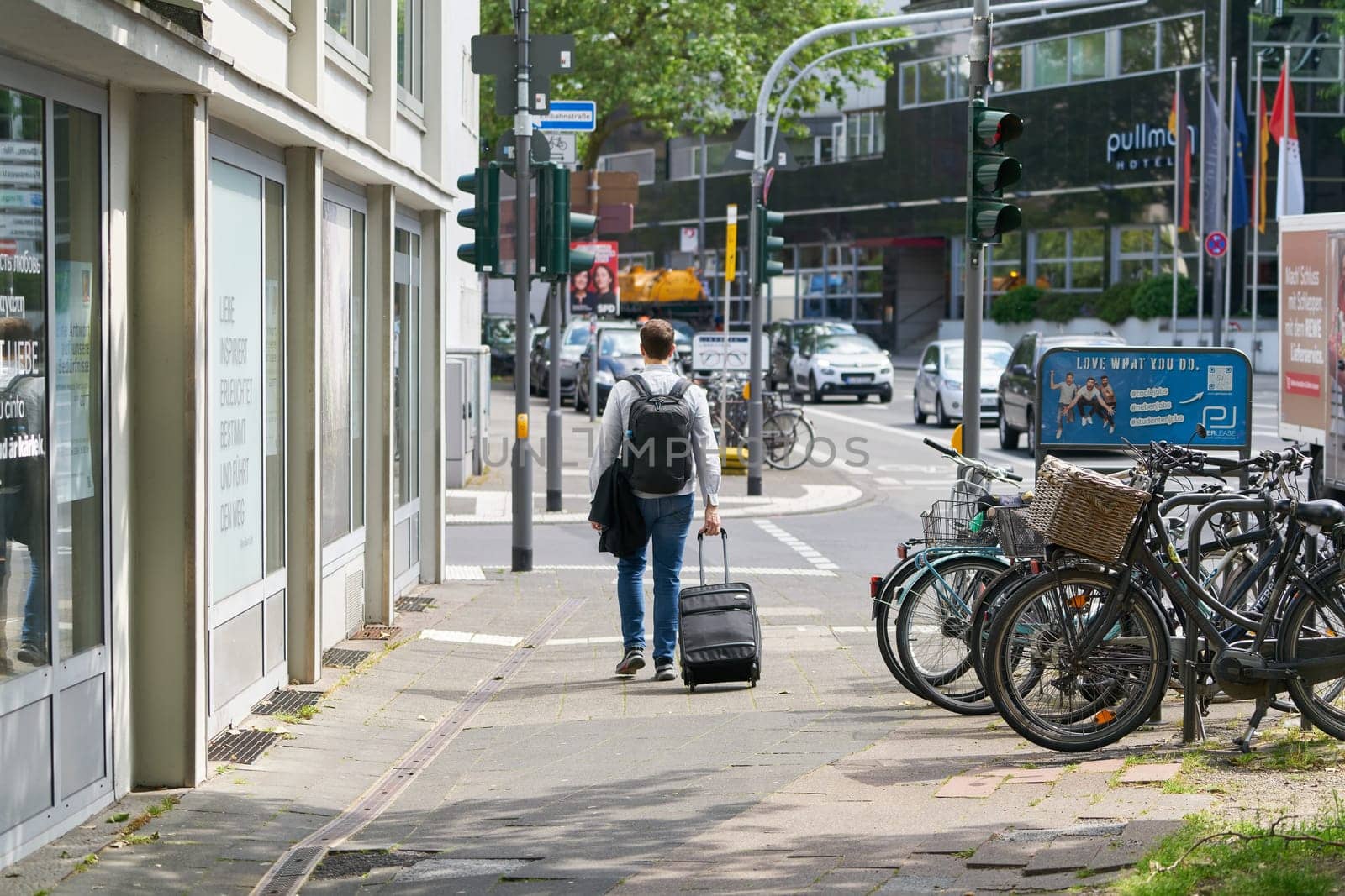 Cologne, Germany – May 23, 2024: Business traveler in Cologne on the way from the hotel to the train station
