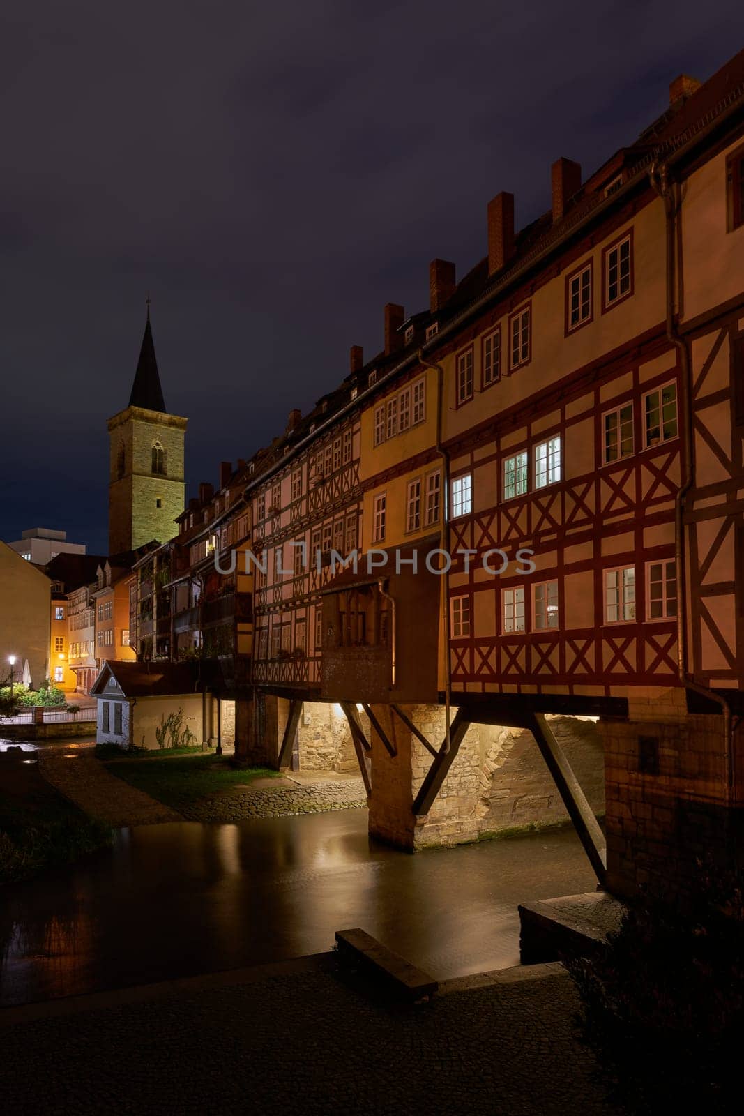 The Kramerbrucke with the river Gera in the old town of Erfurt in Germany at night