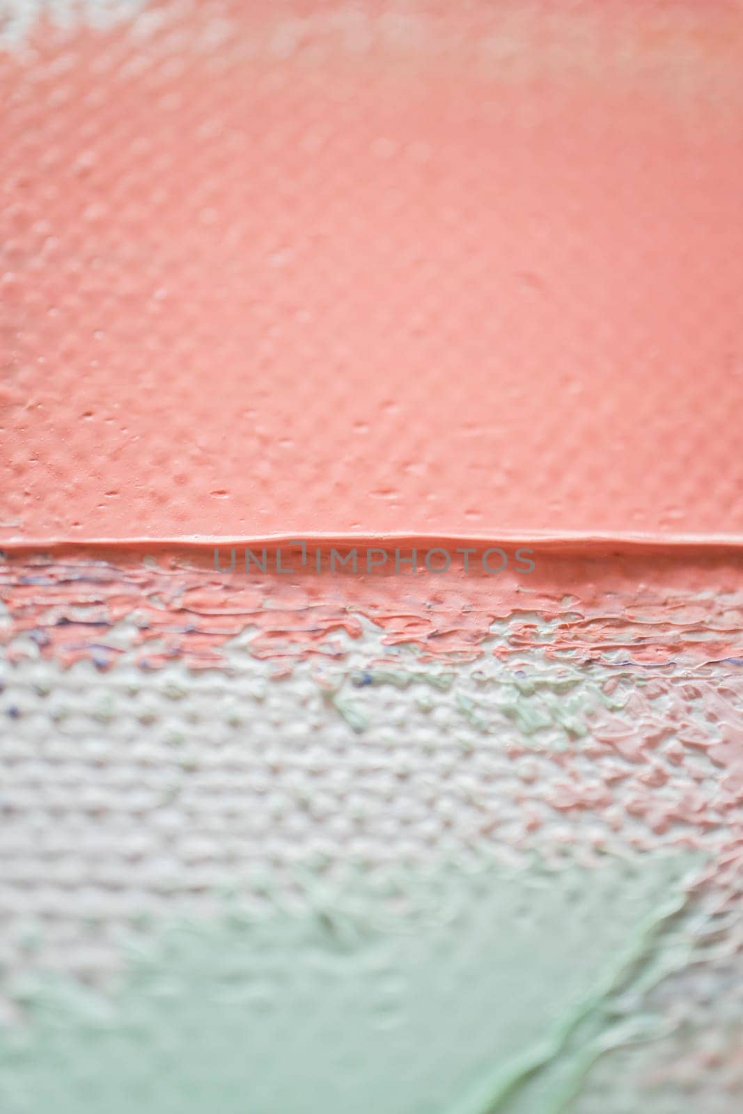 Soft pastel colors merge on the canvas, creating a harmonious blend of peach, white, and green tones. The textured surface invites closer observation of the artistic details.
