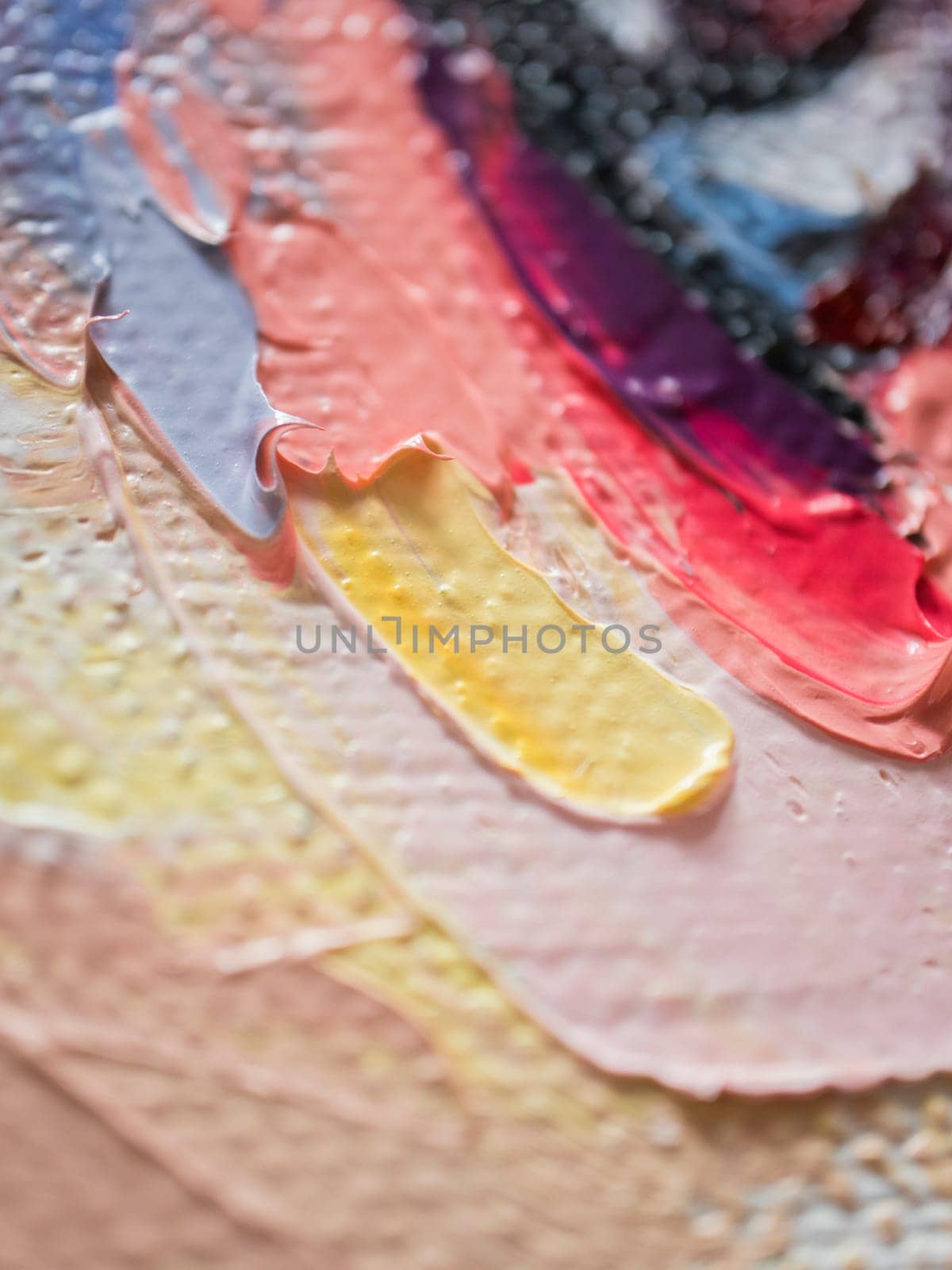 Vivid layers of oil paint blend and swirl on canvas, showcasing a rich palette of colors and textures. The dynamic composition captures the essence of artistry in its abstract form and style.