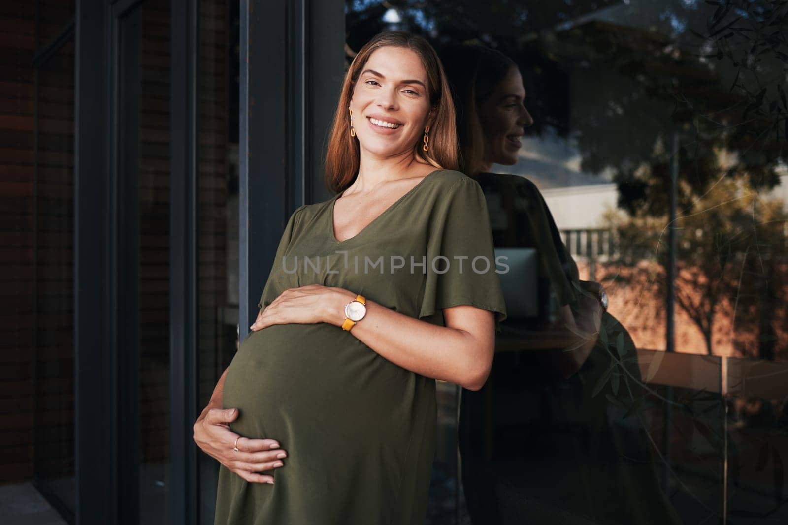 Portrait, smile and a business pregnant woman on the balcony at her office, excited about maternity leave from work. Company, stomach and pregnancy with a happy young employee at the workplace.