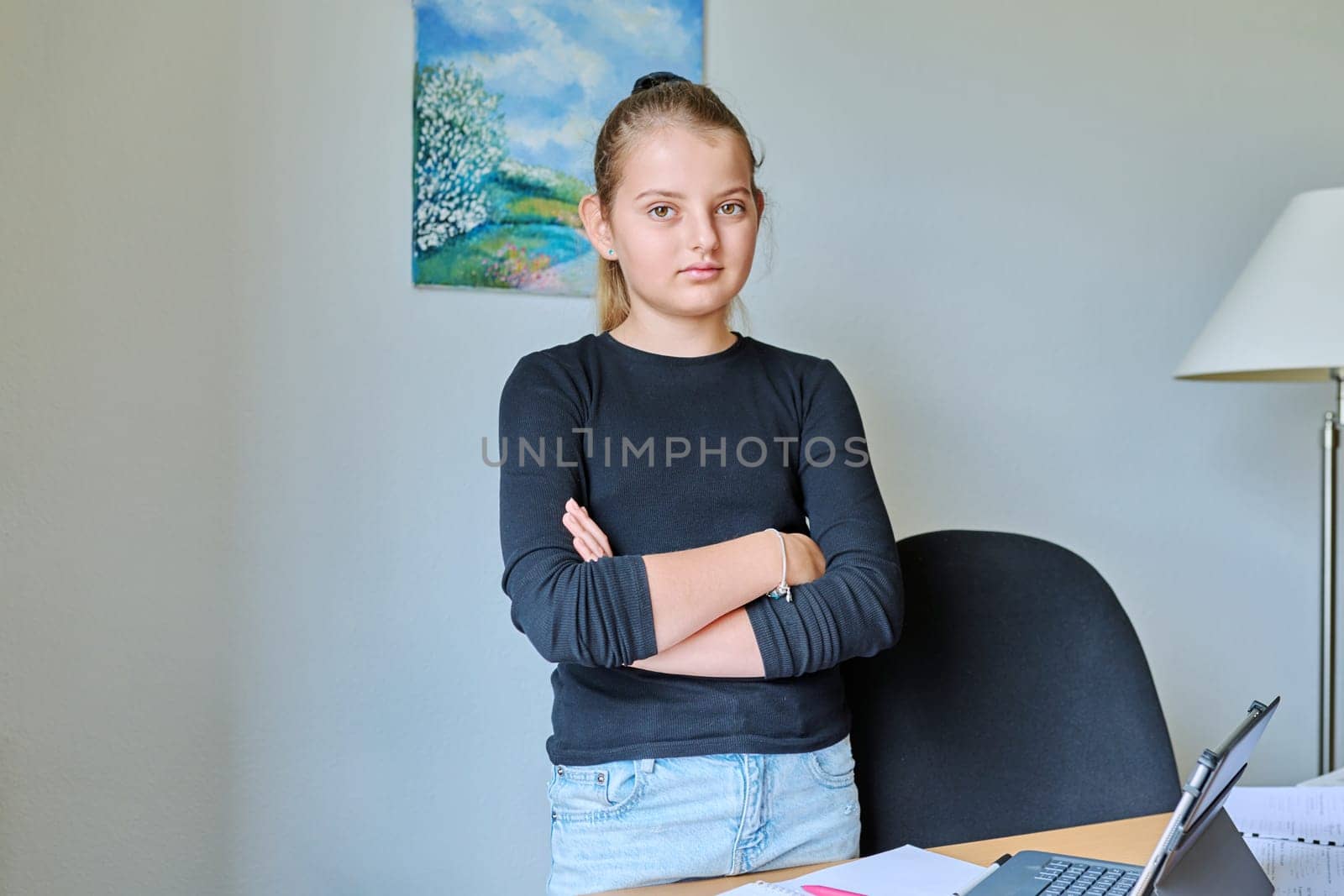 Portrait of child girl 10 years old inside on background of light wall by VH-studio