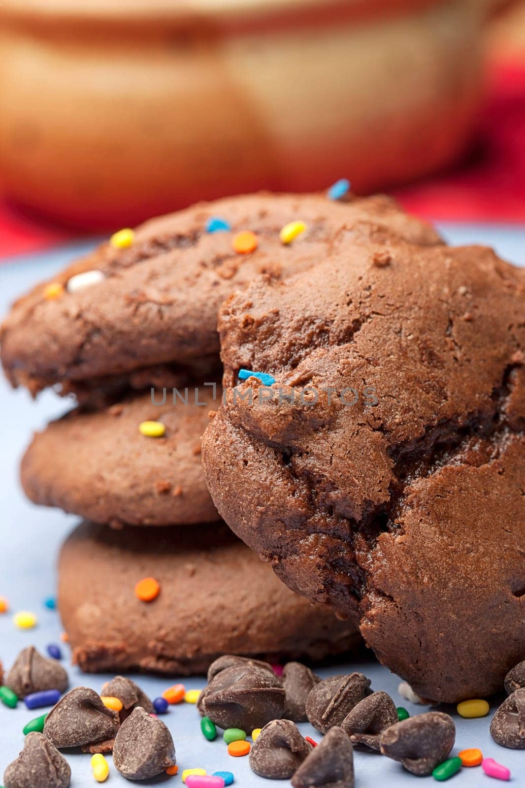 Close up photo of chocolate chip cookies with color sprinkles on them.