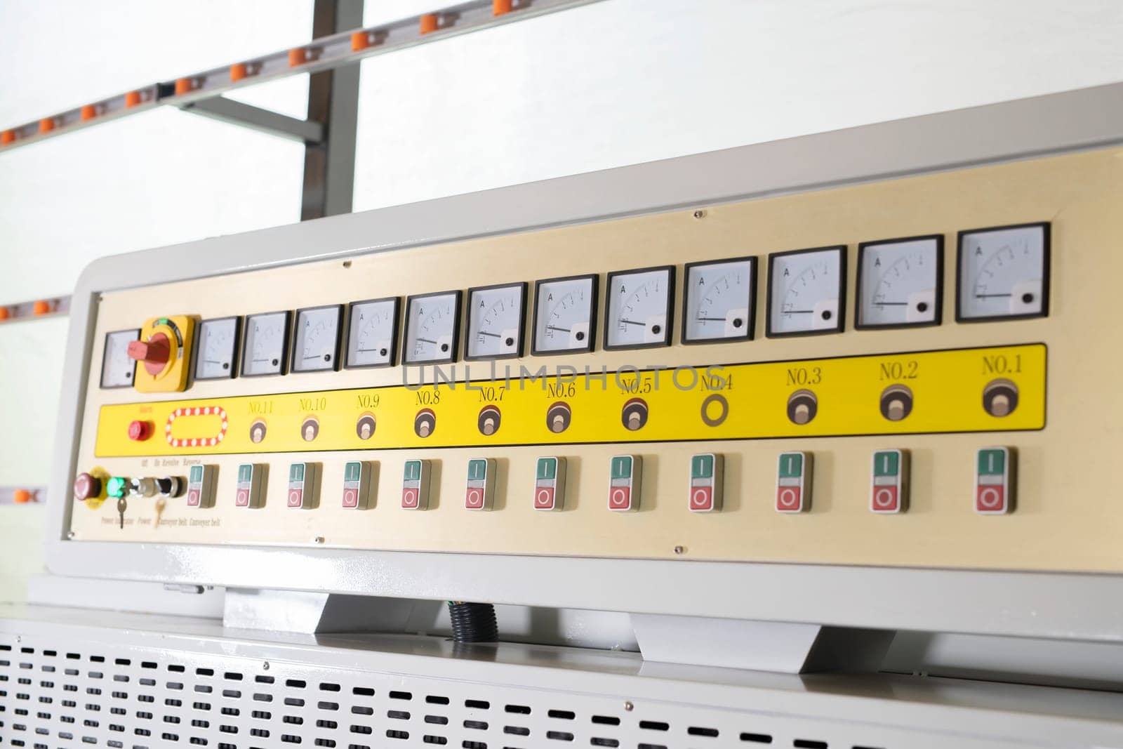 Various buttons and displays on control panel of industrial glass polish machine on factory