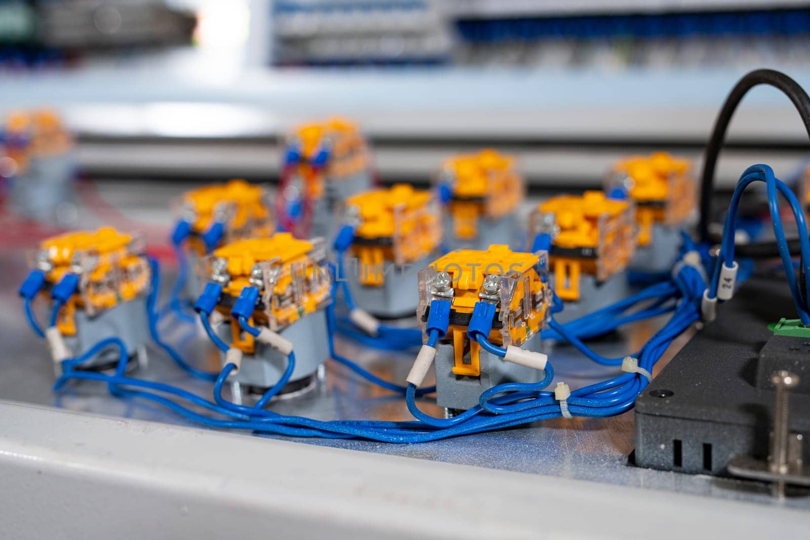 Contemporary electrical equipment with various plastic connectors and wires on control panel in lab