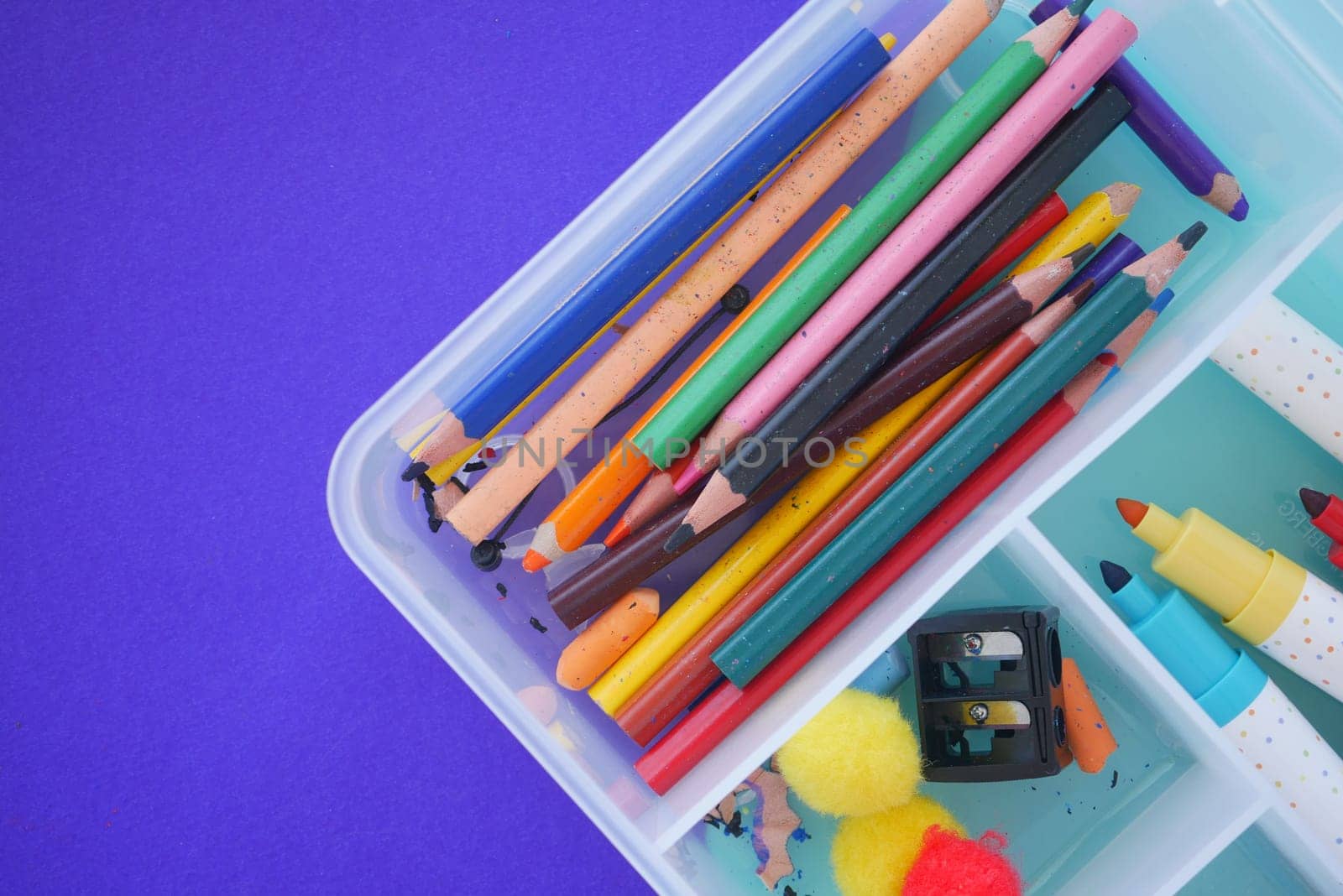 Various colored pencils and crafting materials are organized neatly.