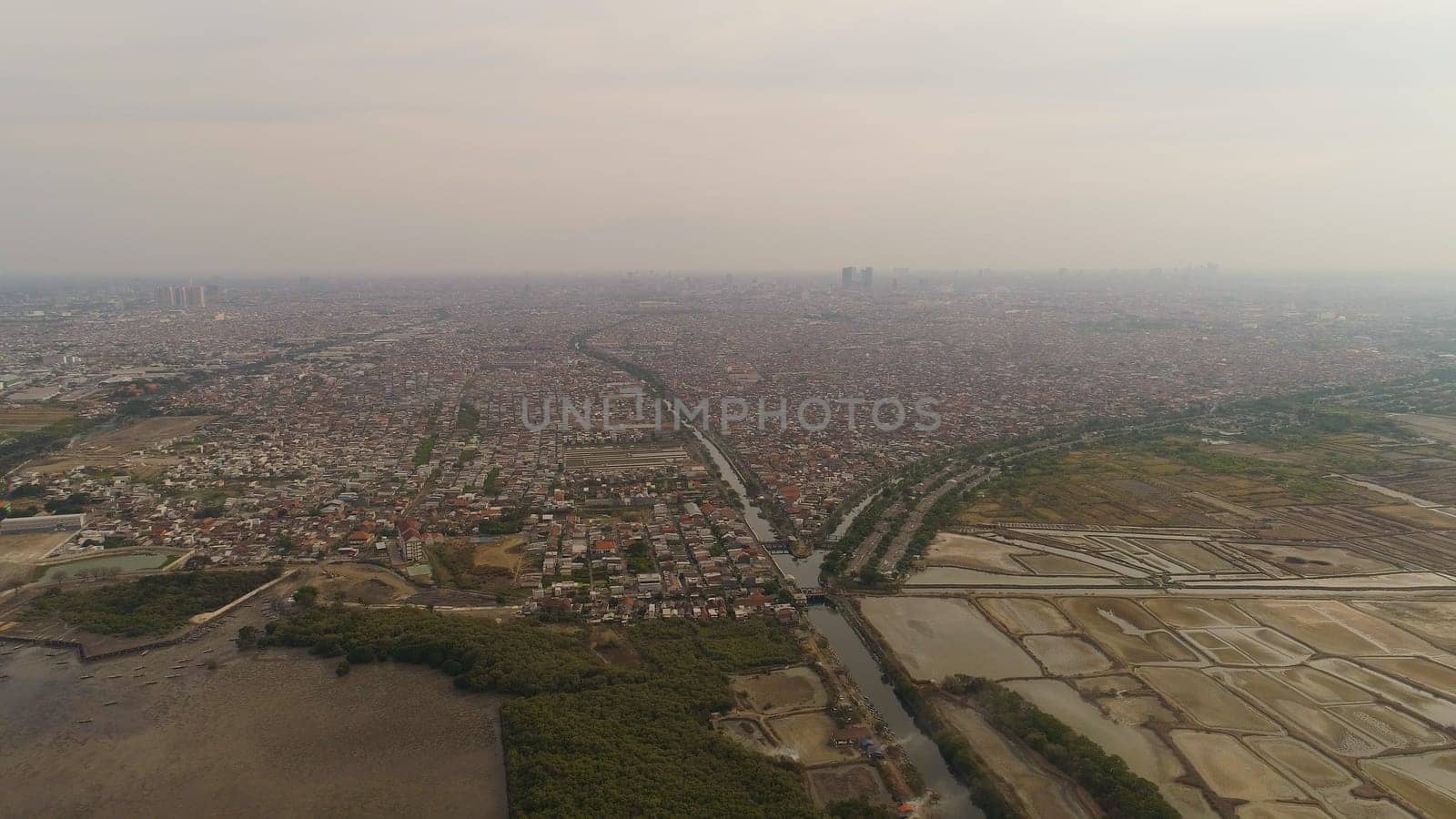 Aerial cityscape modern city Surabaya with skyscrapers, buildings and houses. Surabaya capital city east java, indonesia