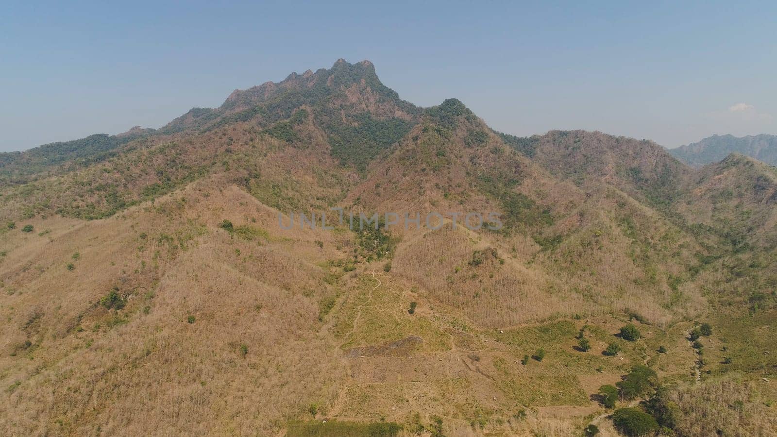 aerial view mountain hilly landscape in asia. mountain range with high cliffs mountain slopes covered with vegetation