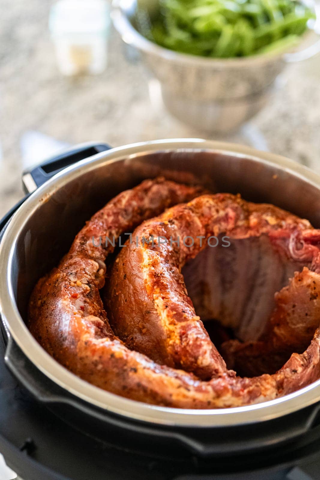 In a sleek modern kitchen, we Are adding an extra layer of flavor to succulent baby back ribs by infusing them with a medley of spices in a multicooker-a mouthwatering feast in the making.