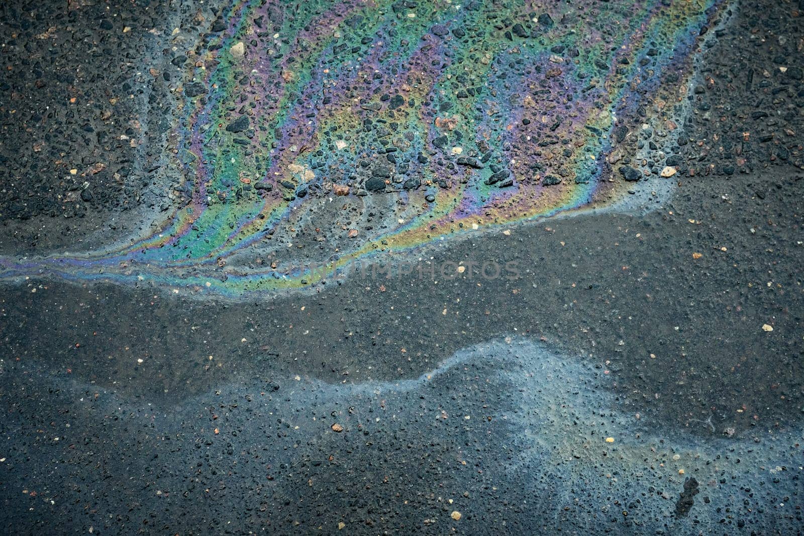 Vibrant oil slick forming a captivating abstract design that draws the eye.