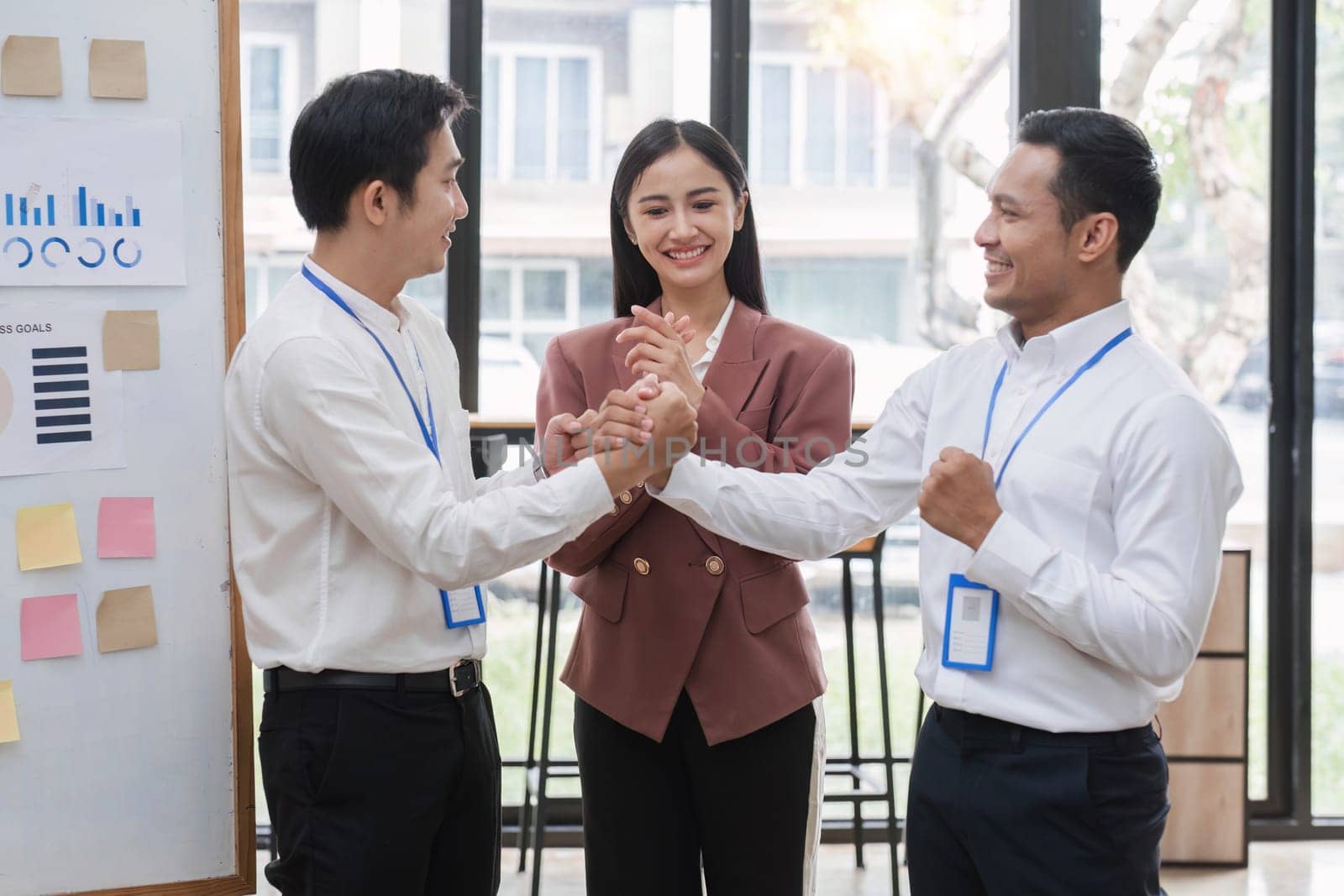 Professional businessmen shake hands to congratulate after business success..