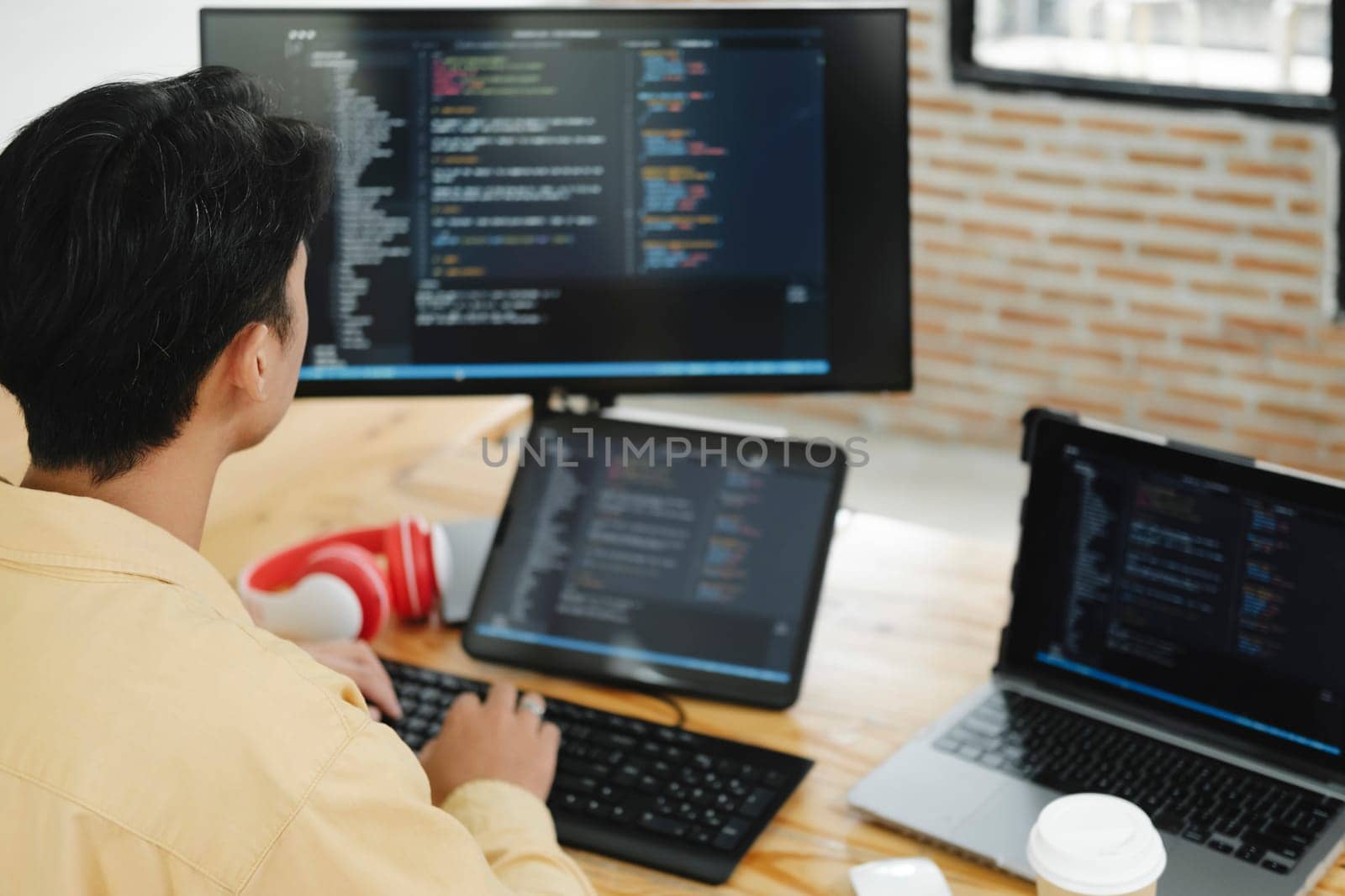 IT Programmer Starts Working on Desktop Computer. The Website Developer, Software Engineer Developing App, Video Game. Terminal with Coding Programming Language.