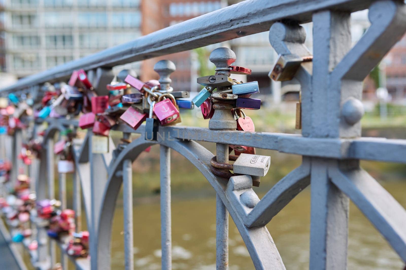 Hamburg, Germany, 1.08.2023, many closed heart love locks on the bridge. Romantic symbols signs