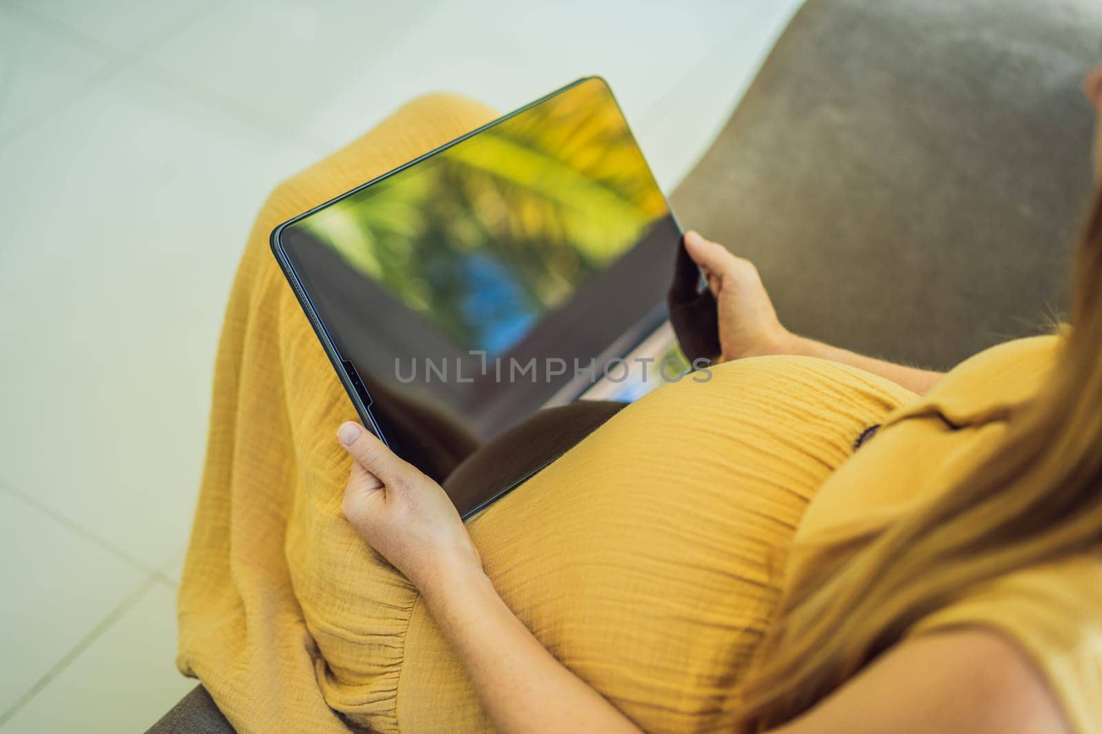 Mobile pregnancy online maternity application. Pregnant mother using phone. Pregnancy, medicine, pharmaceutics, health care and people concept by galitskaya
