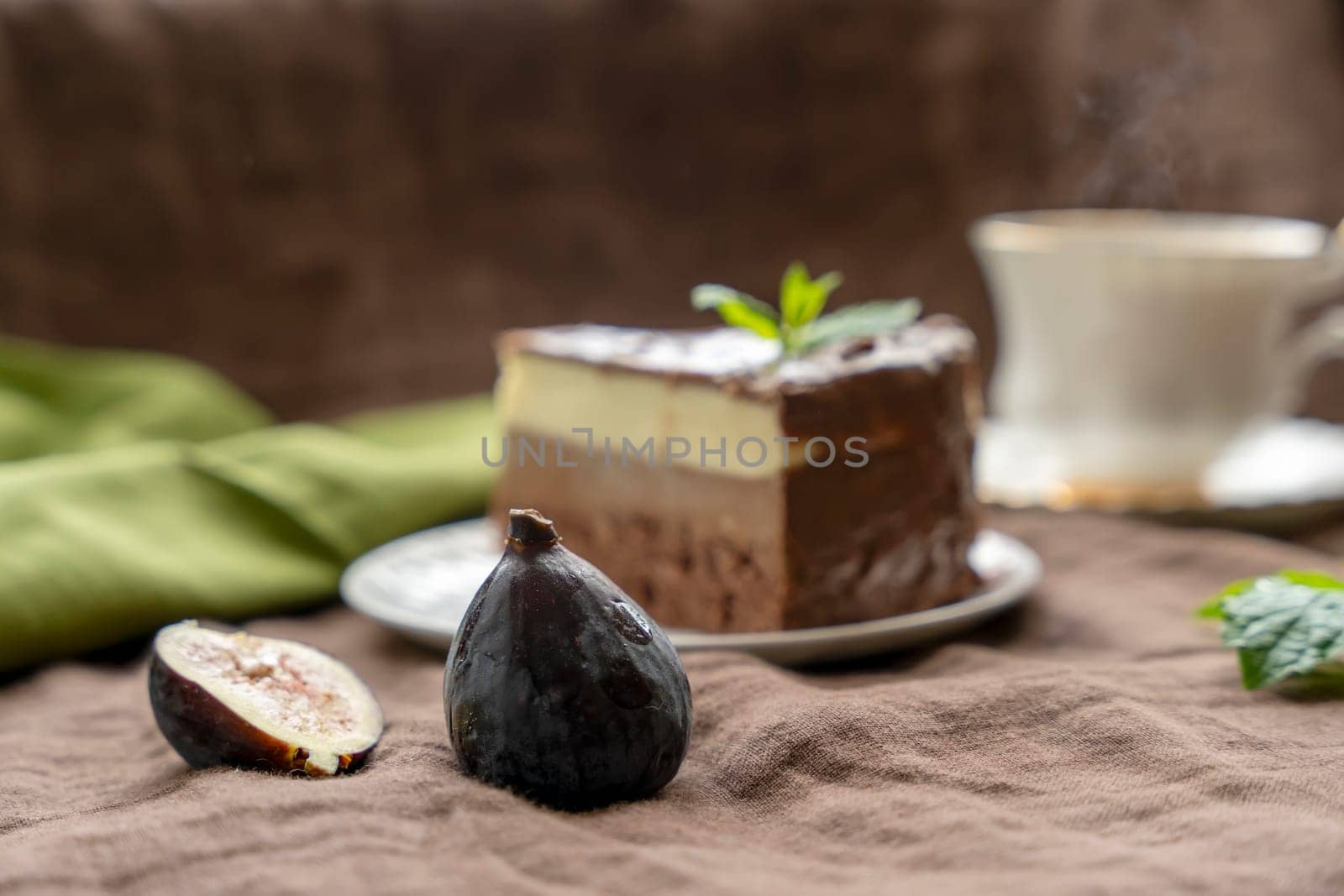 chocolate cake on white plate and tea with strawberry by Iryna_Melnyk