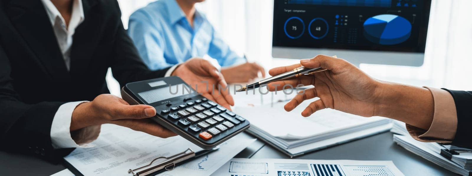 Auditor and accountant team working in office, analyze financial data and accounting record with calculator. Accounting company provide finance and taxation planning for profitable cash flow. Insight