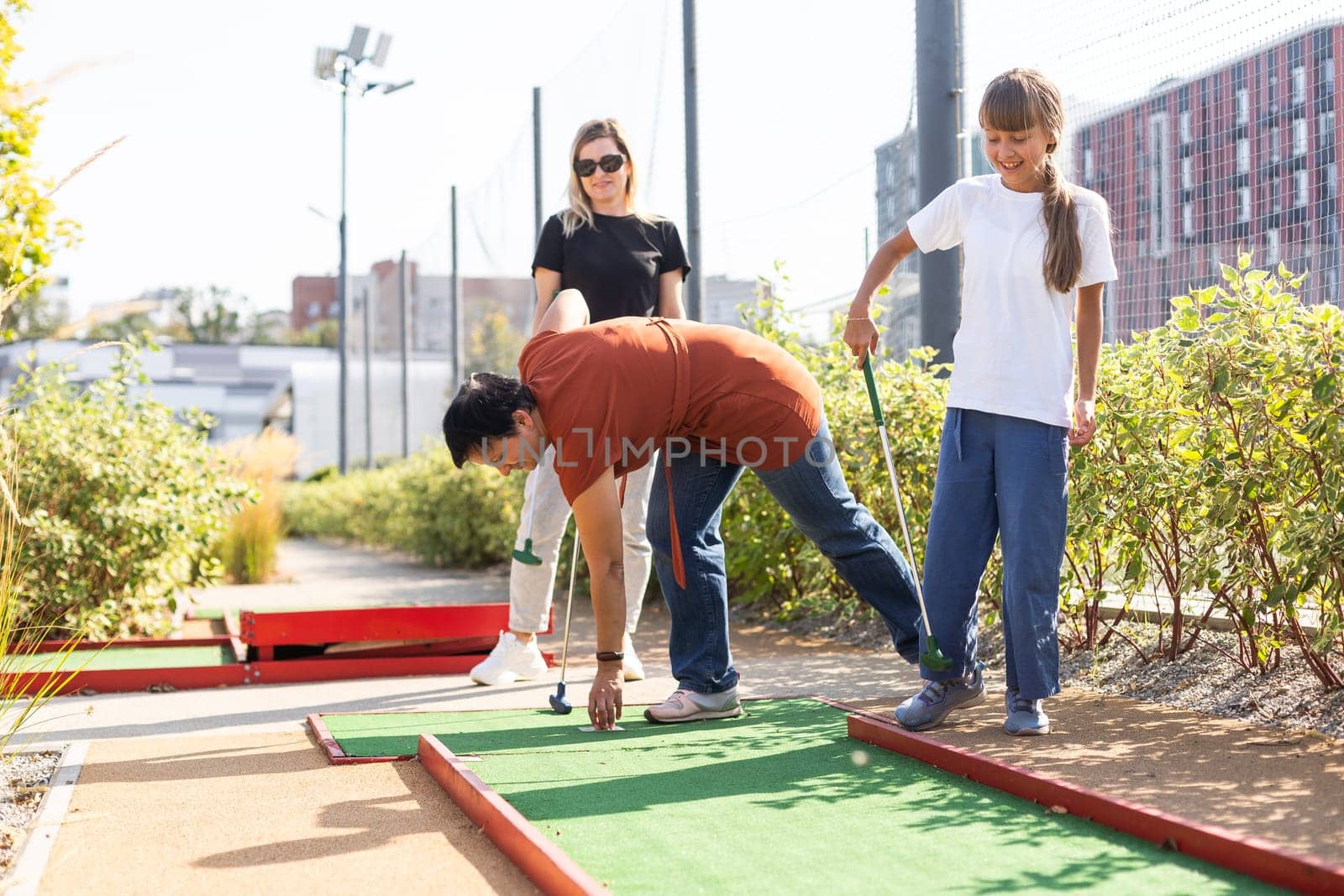 Golf course group of friends people with children posing standing. High quality photo