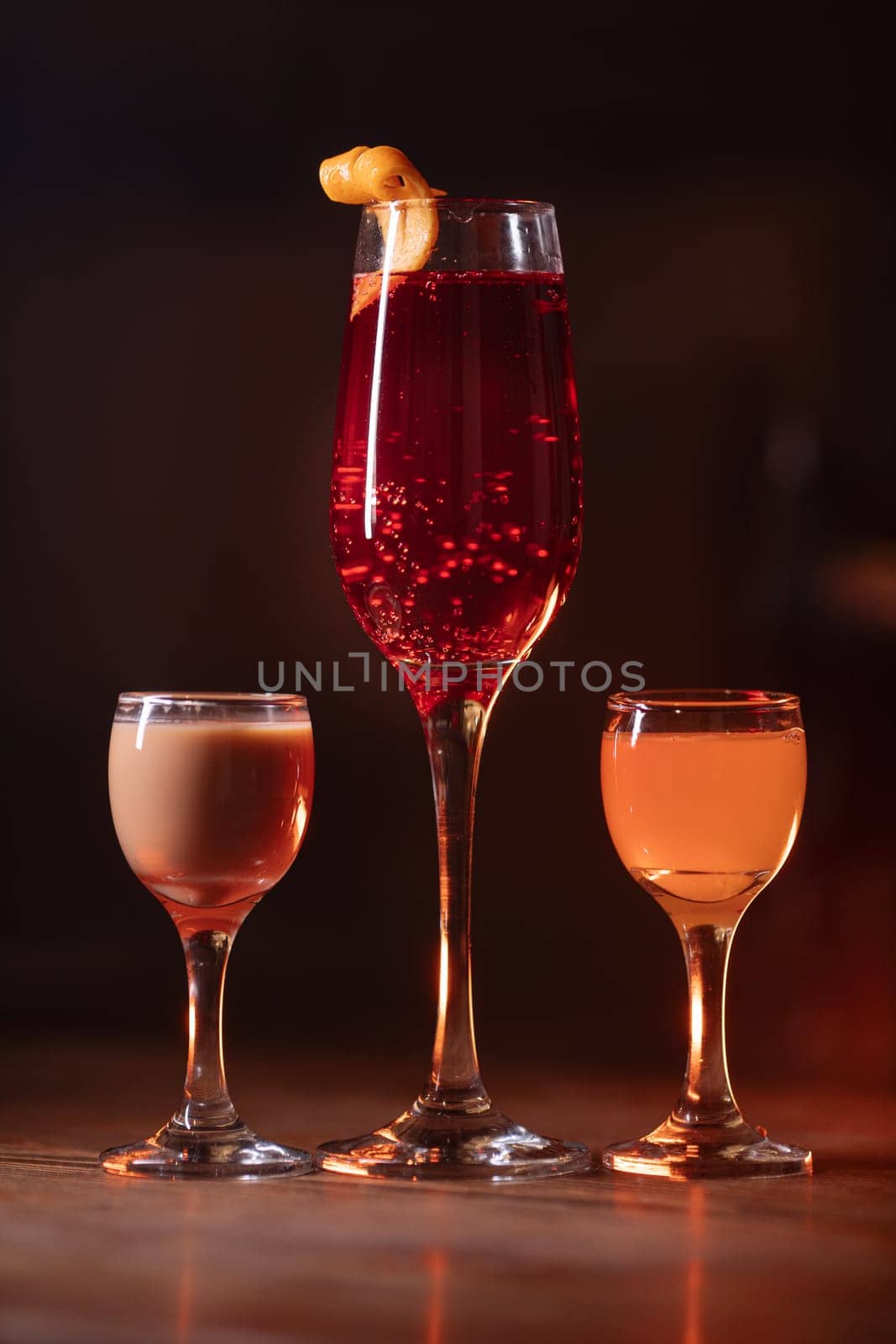 A beautiful bright cocktail. Restaurant, a glass with a drink is on the table.