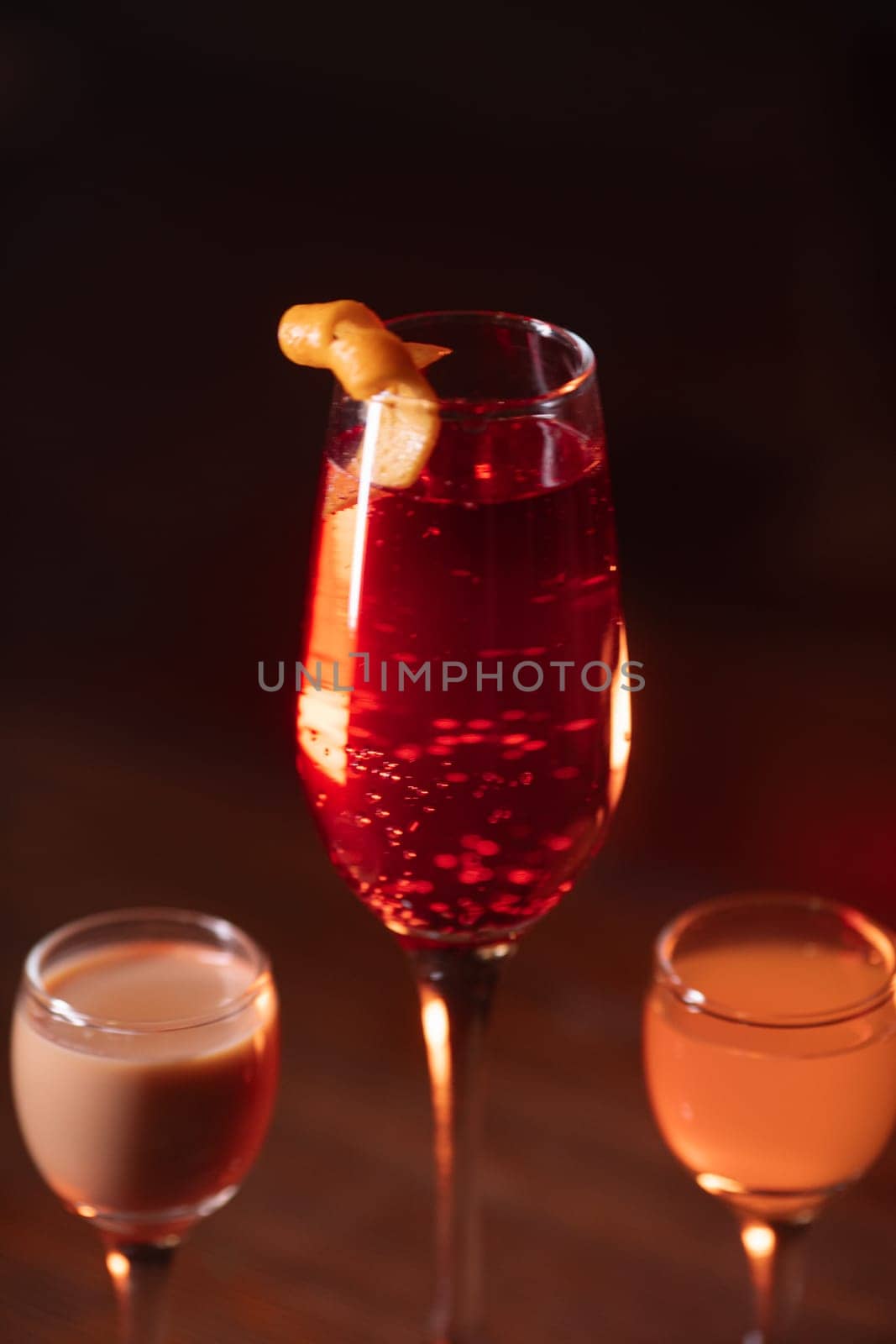 A beautiful bright cocktail. Restaurant, a glass with a drink is on the table.