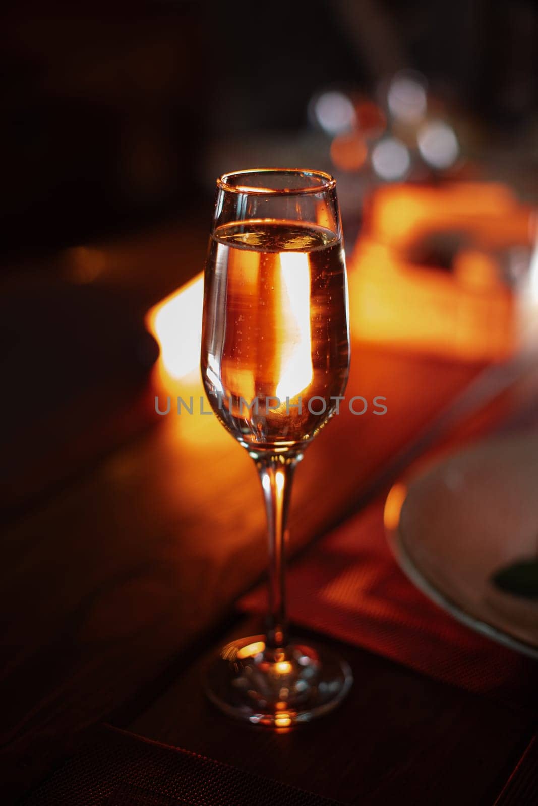 A beautiful bright cocktail. Restaurant, a glass with a drink is on the table.