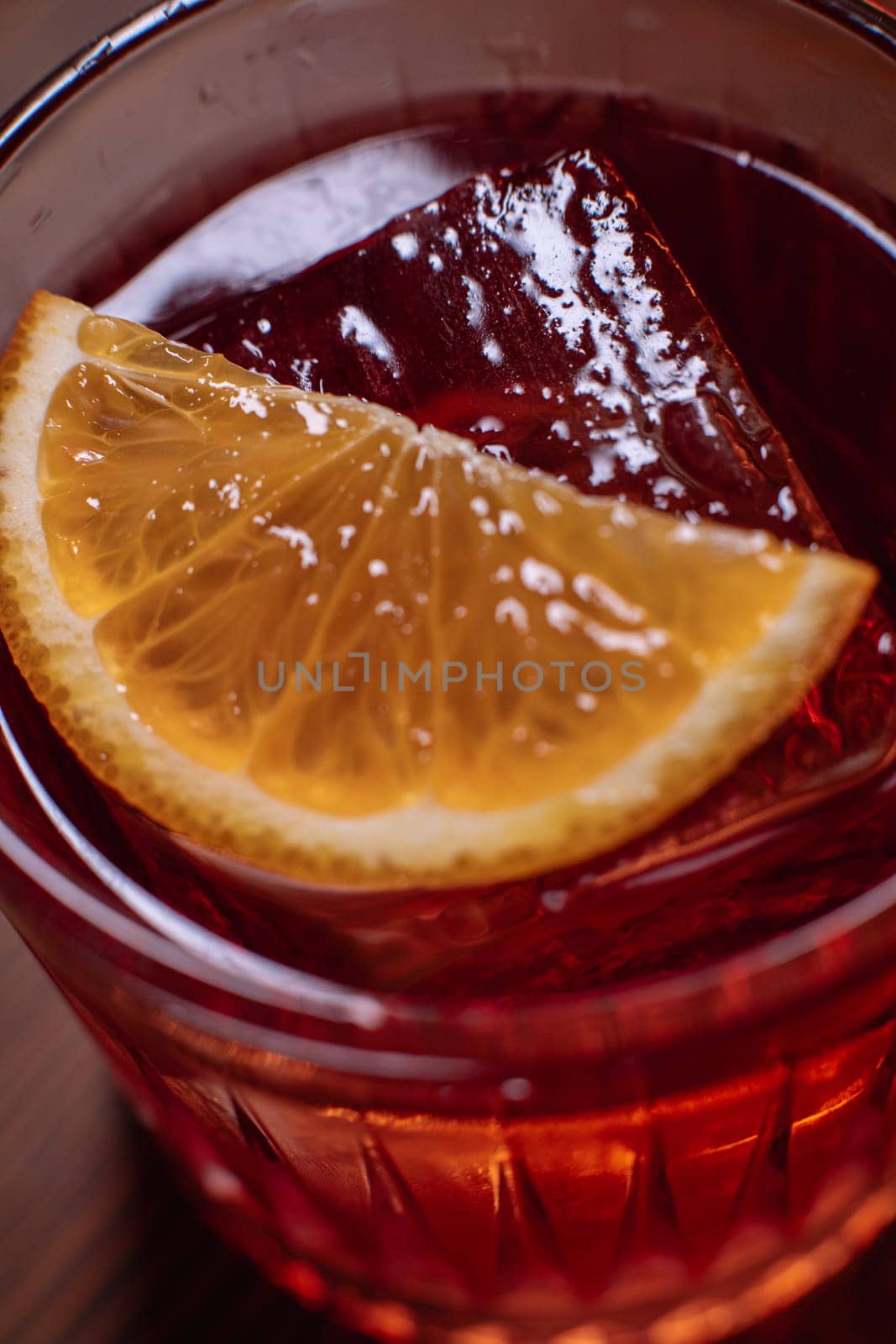 A beautiful bright cocktail. Restaurant, a glass with a drink is on the table.