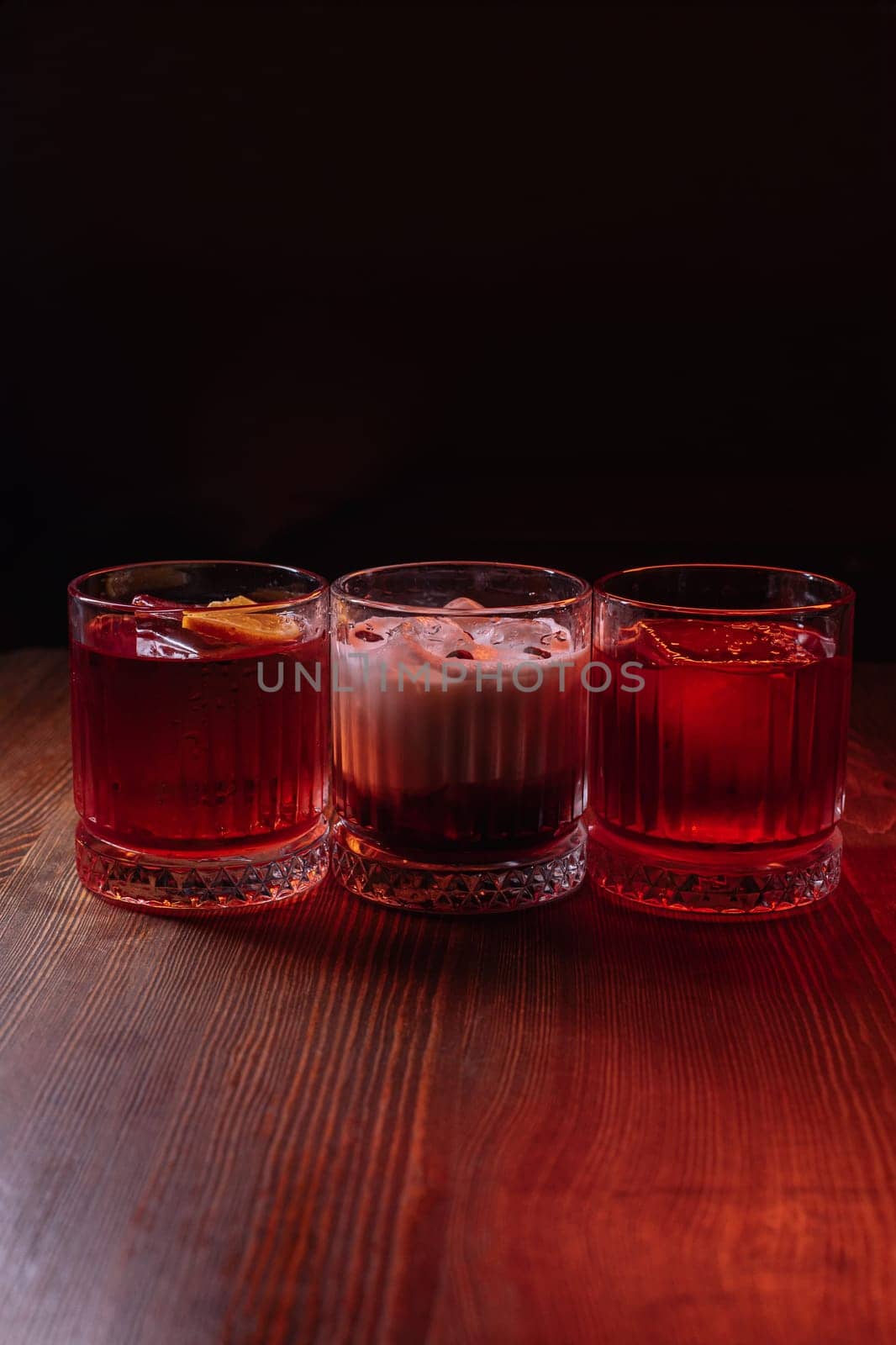A beautiful bright cocktail. Restaurant, a glass with a drink is on the table.