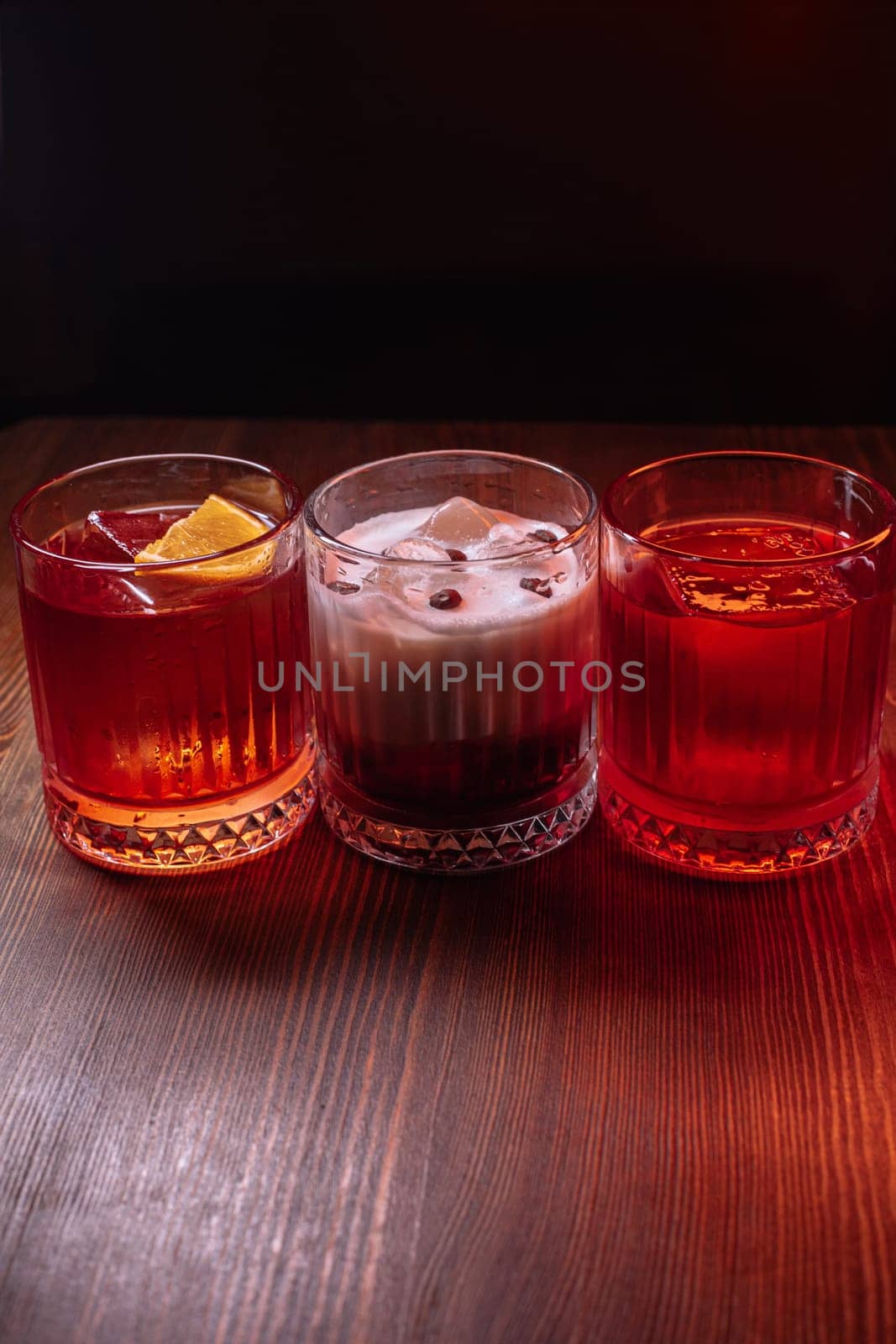 A beautiful bright cocktail. Restaurant, a glass with a drink is on the table.