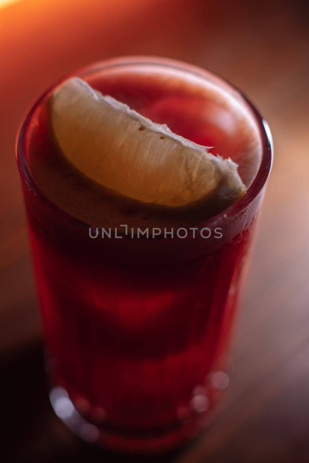 A beautiful bright cocktail. Restaurant, a glass with a drink is on the table.