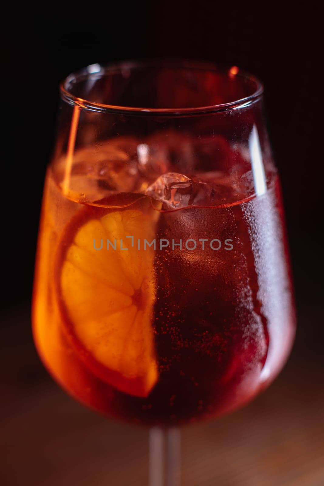 A beautiful bright cocktail. Restaurant, a glass with a drink is on the table.