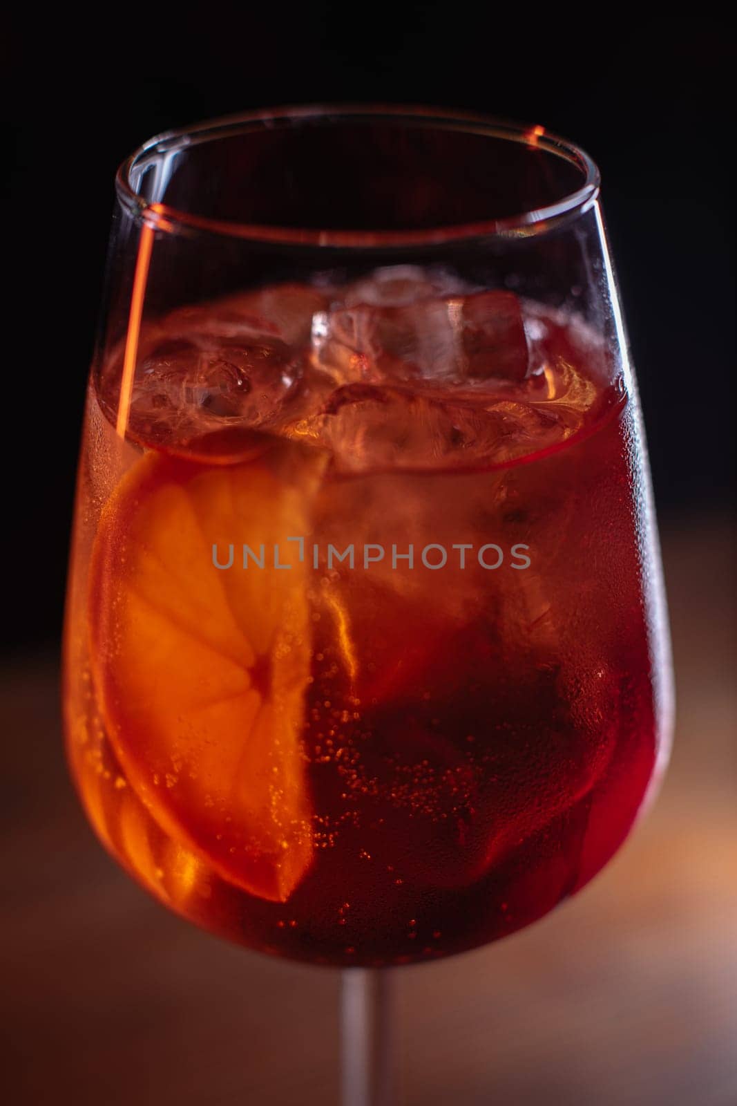 A beautiful bright cocktail. Restaurant, a glass with a drink is on the table.