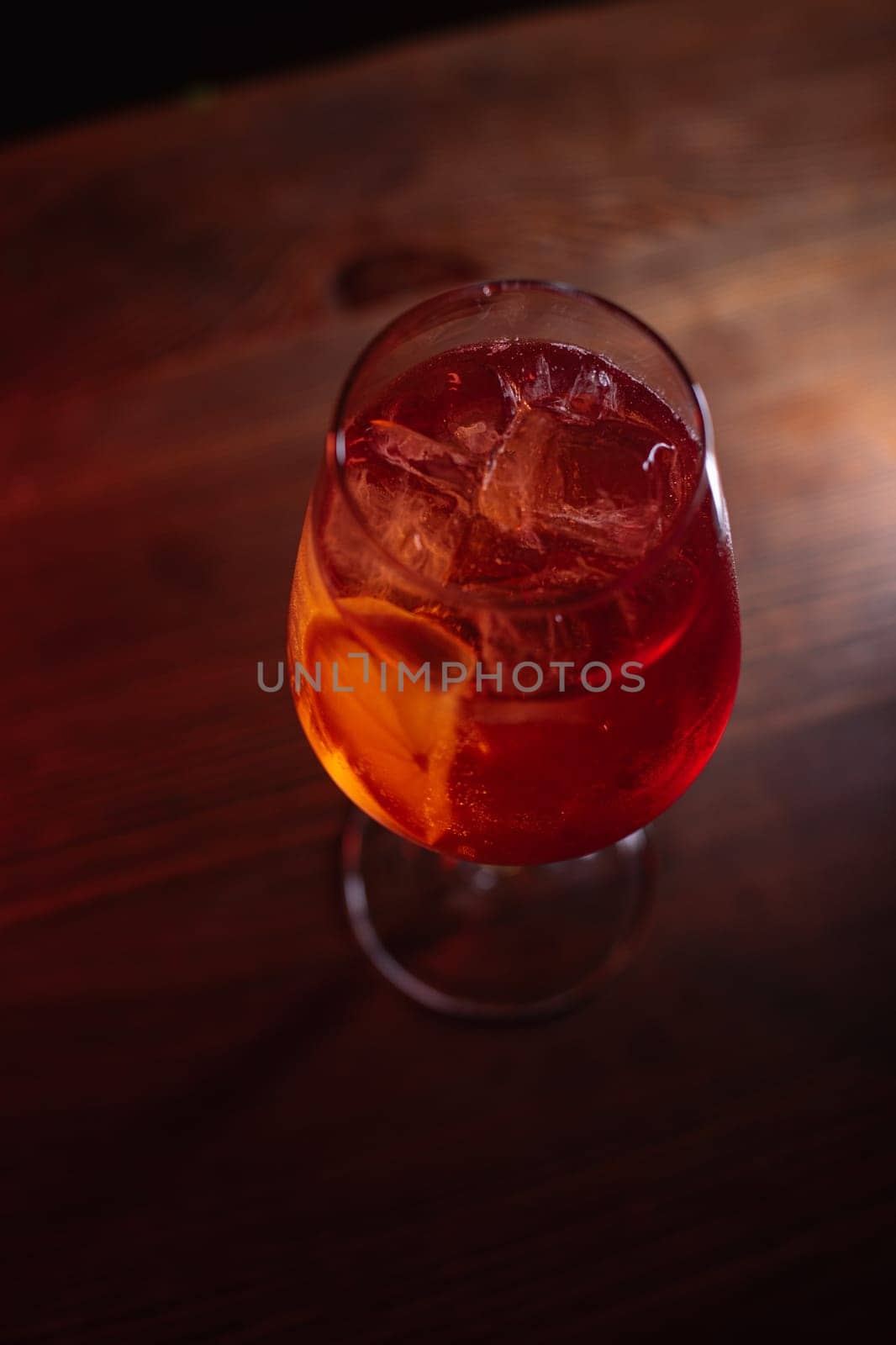 A beautiful bright cocktail. Restaurant, a glass with a drink is on the table.