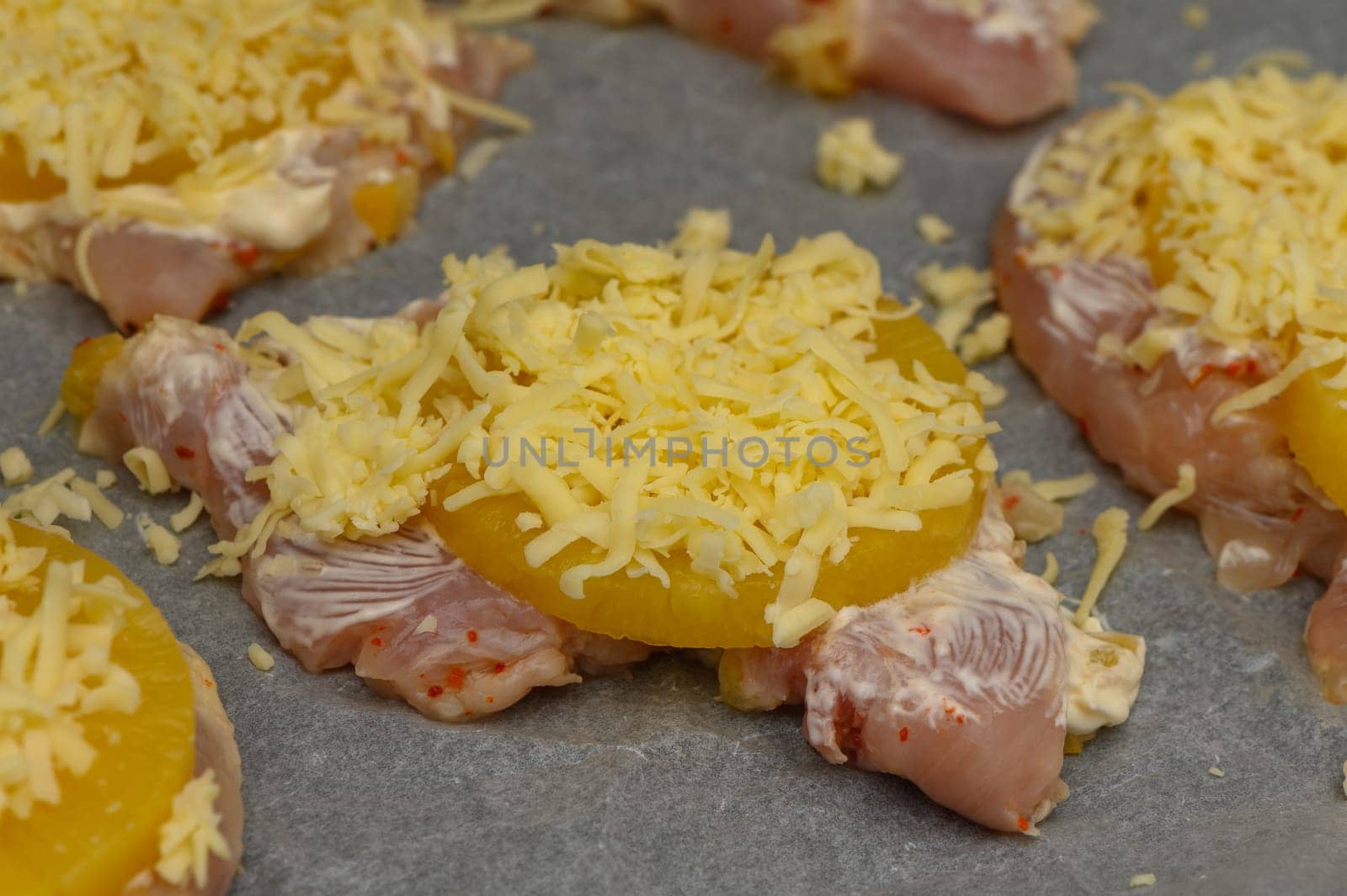 Tender chicken pieces layered with sweet pineapple and melted cheese, prepared for a delightful oven bake.