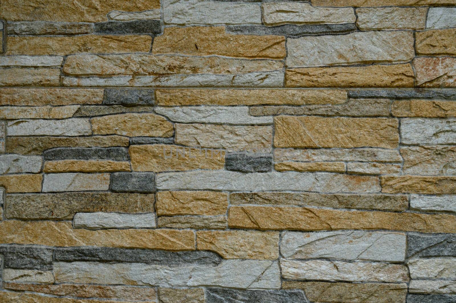 An intricate stone arrangement adds a cozy, earthy vibe with varied textures, ideal for interior decor.