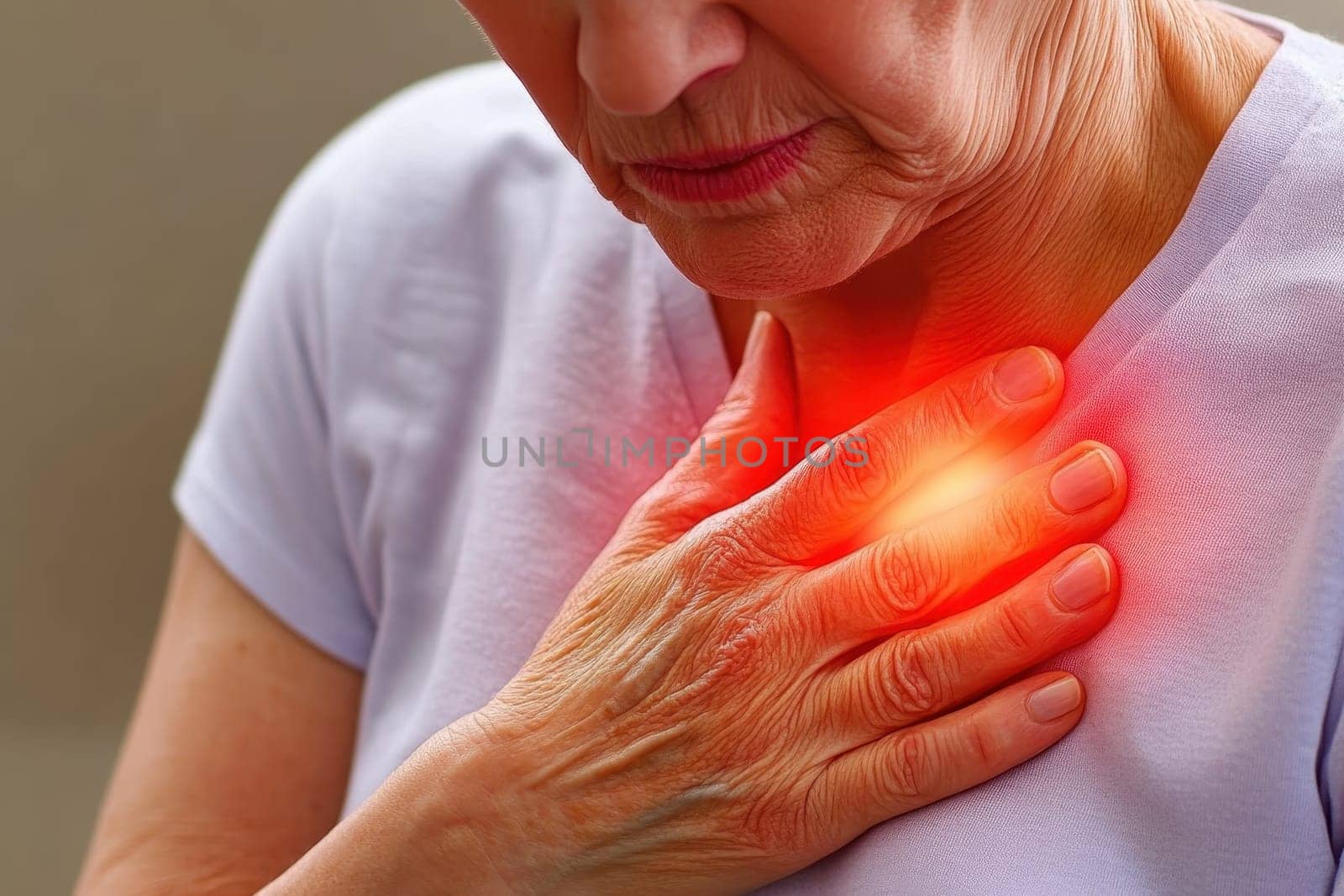 A senior woman clutches her chest with a painful expression, highlighting health concerns. The image conveys emotion and the necessity for medical attention.