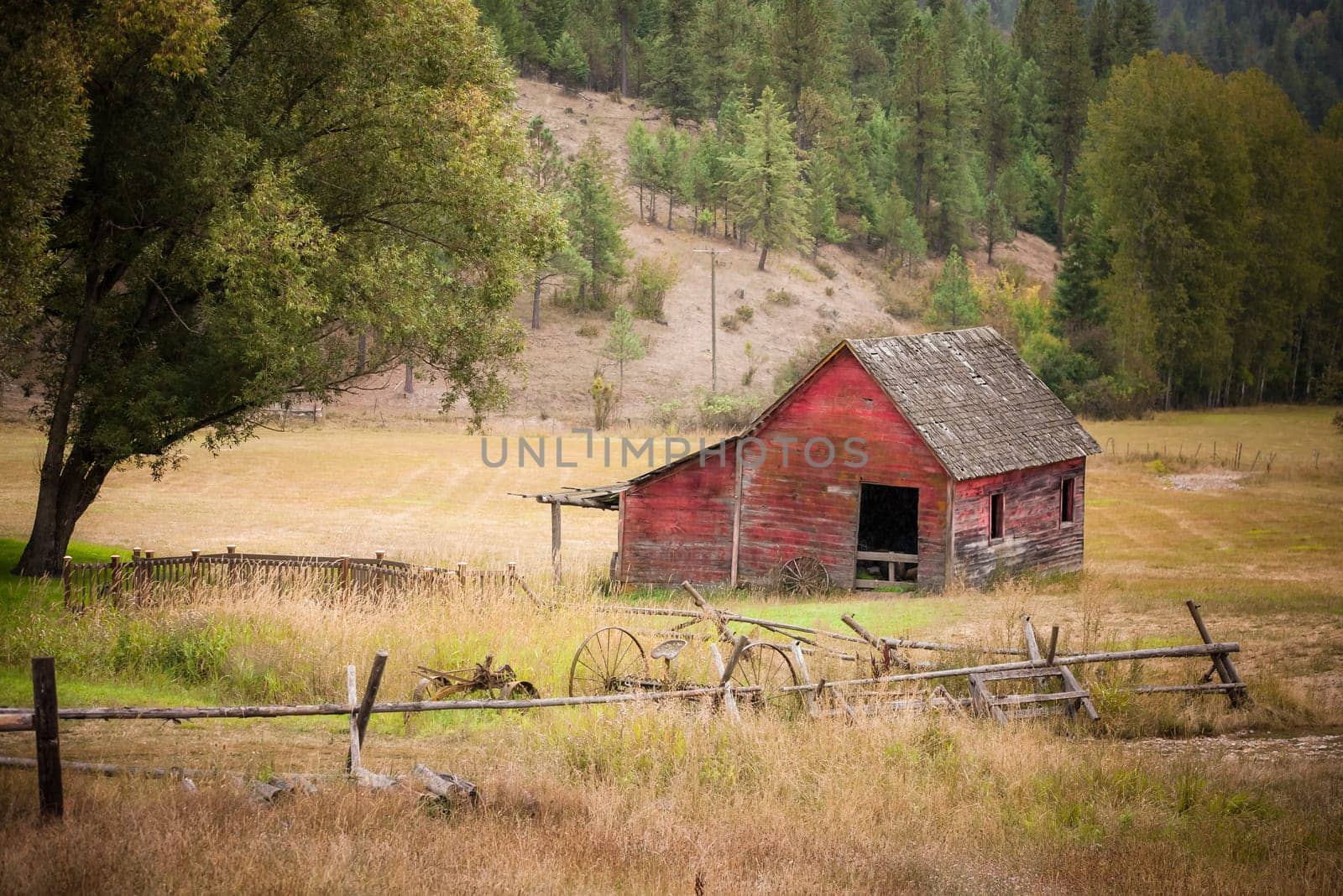 An old red barn in the middle of an open pasture east of Coeur d'Alene, Idaho.