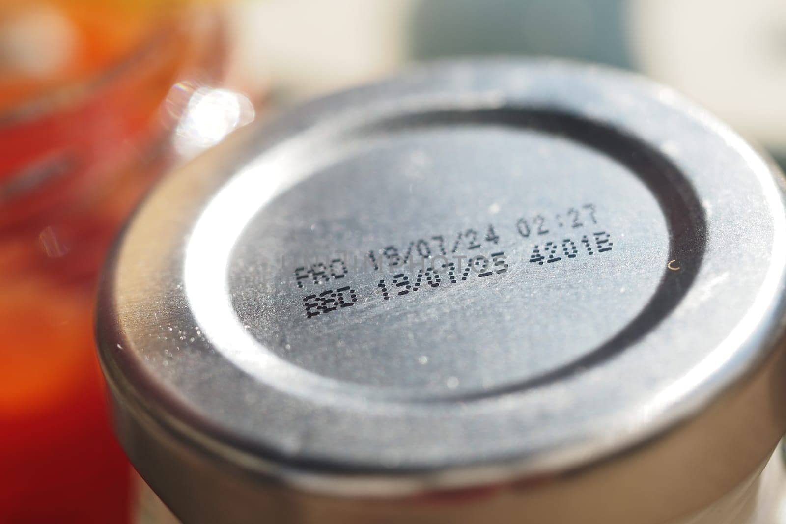 Close-up view of a bottle cap with a date stamp indicating contents.